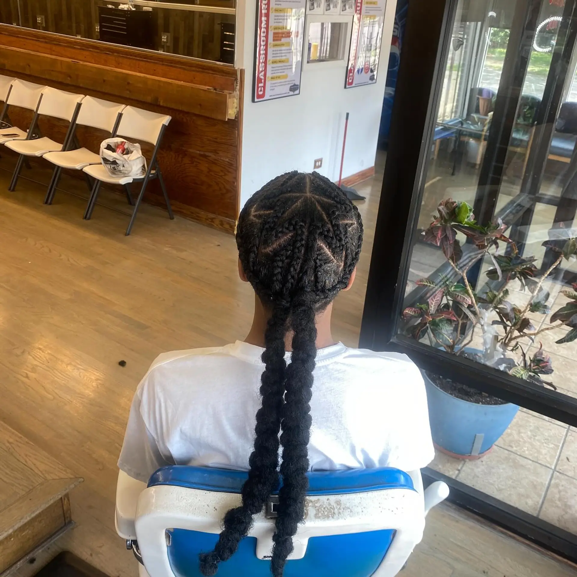 Intricate star-patterned braids extending into long, free-flowing braids. 1