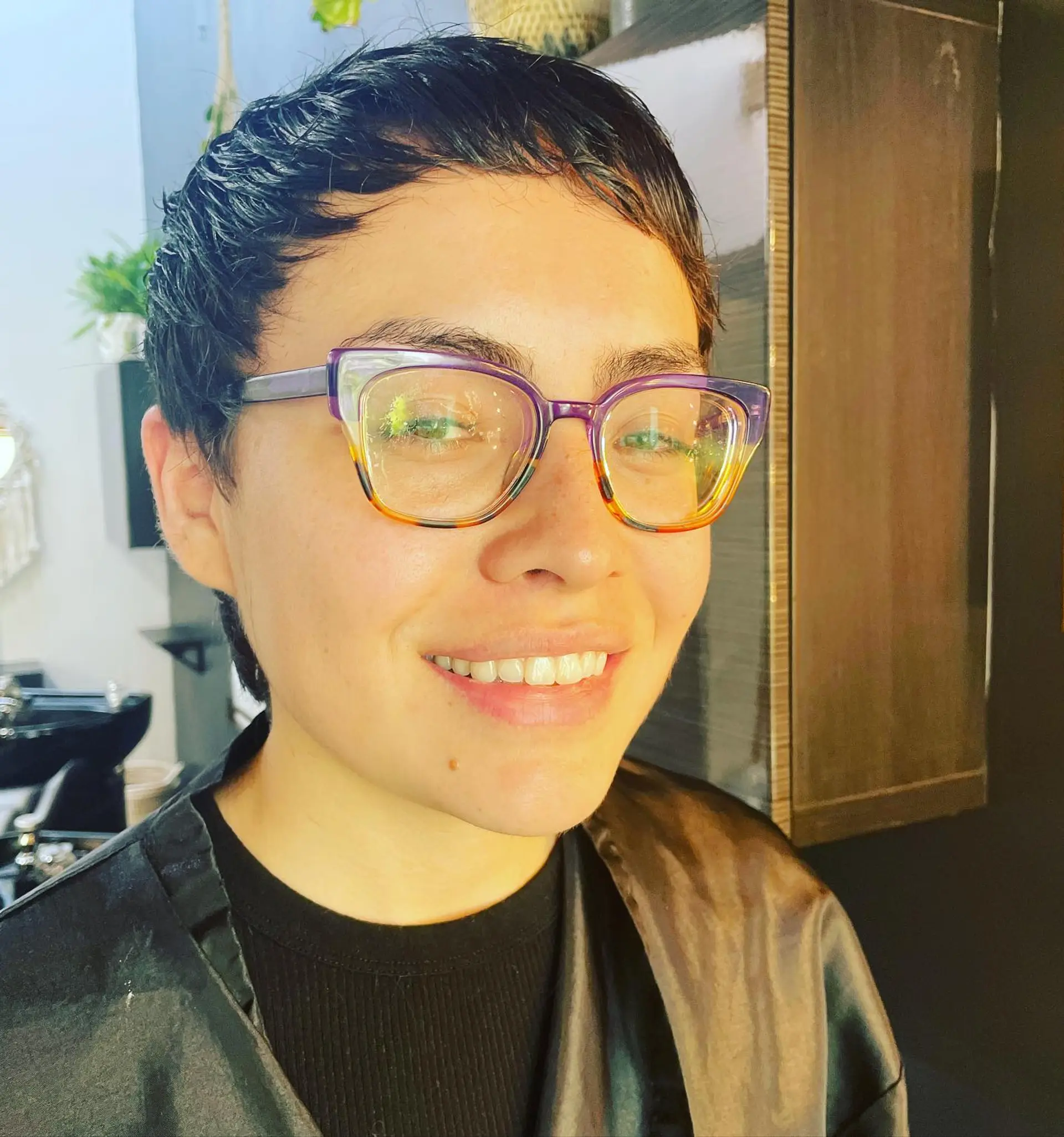 A short, piecey pixie cut featuring micro bangs and textured layers. 1