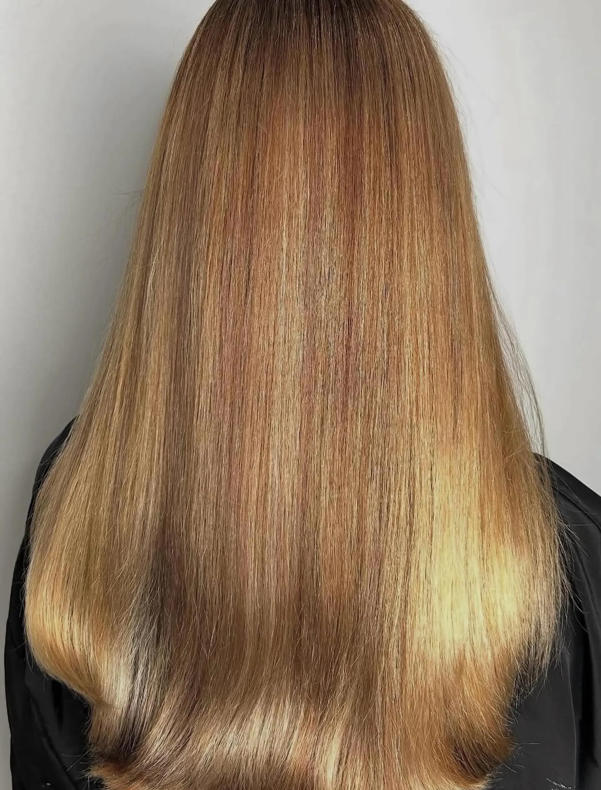 Long straight hair featuring blended multi-tonal warm golden and honey blonde highlights. 1
