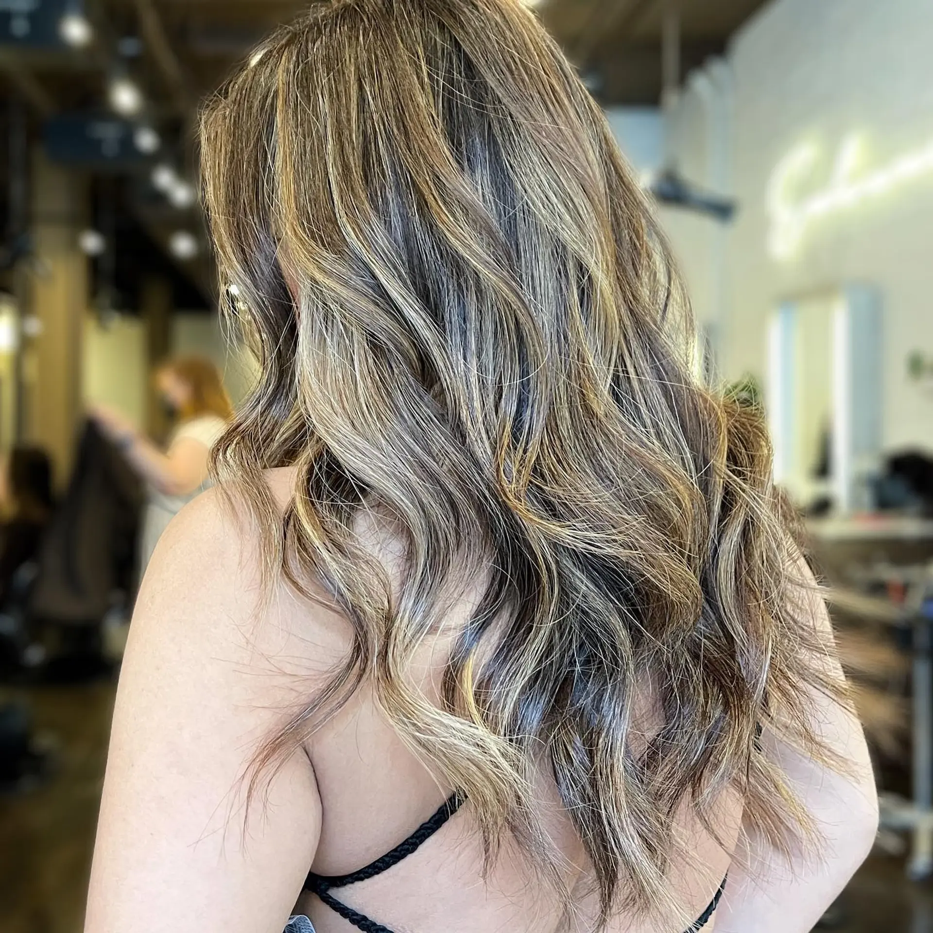 Long layered bronde balayage with soft waves. 1