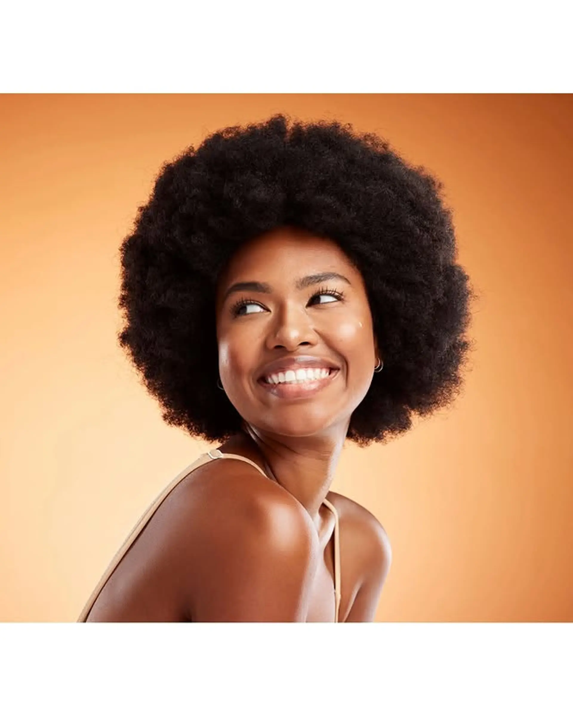 A voluminous, medium-length afro with defined coils. 1