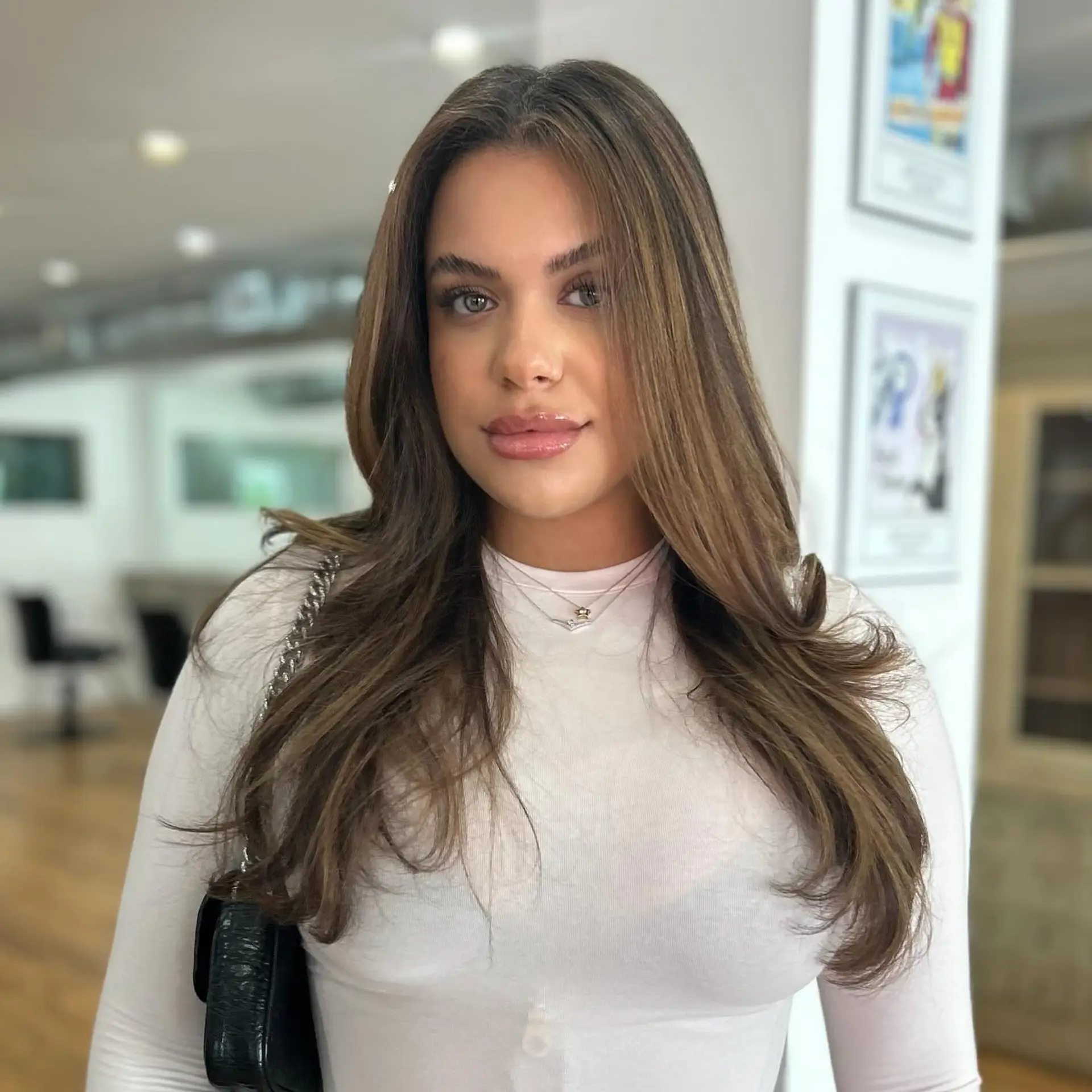 A long, layered hairstyle with a bronde balayage. 2