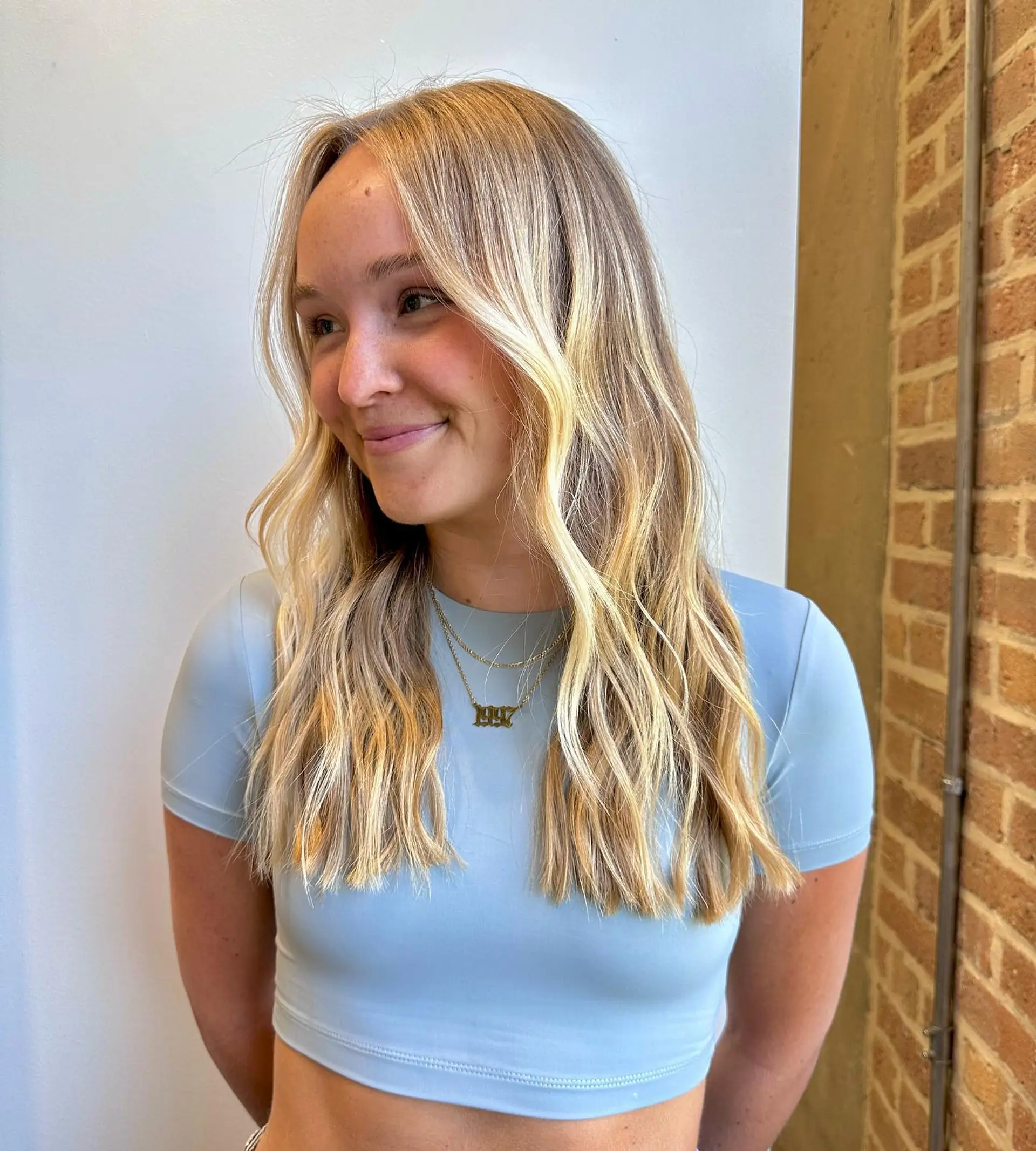 A medium-length wavy hairstyle with a natural, beachy texture. 1