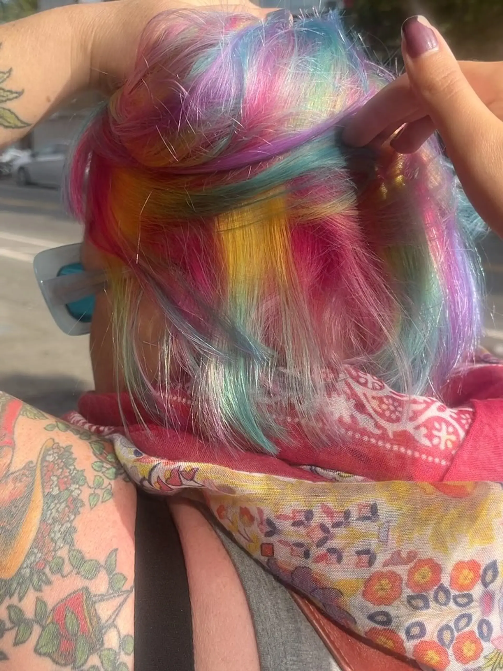 A multi-tonal rainbow color application blending vivid pastel shades of pink, yellow, blue, and purple. 1