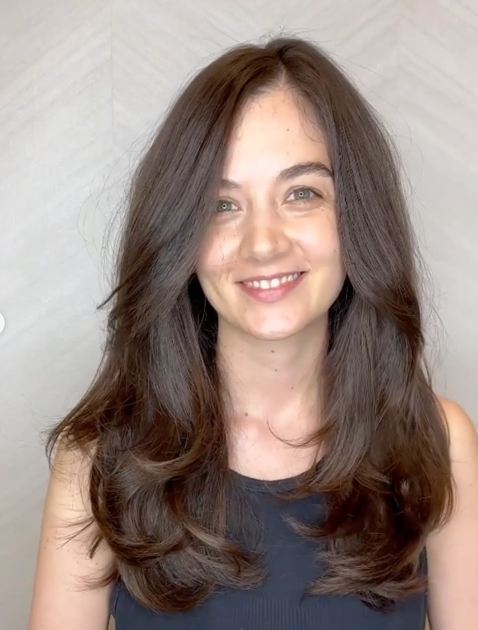 Long, wavy, dark brown hair with voluminous, face-framing layers, exuding a flowing elegant look.

Cut and style by @juliamannino_hair
 1