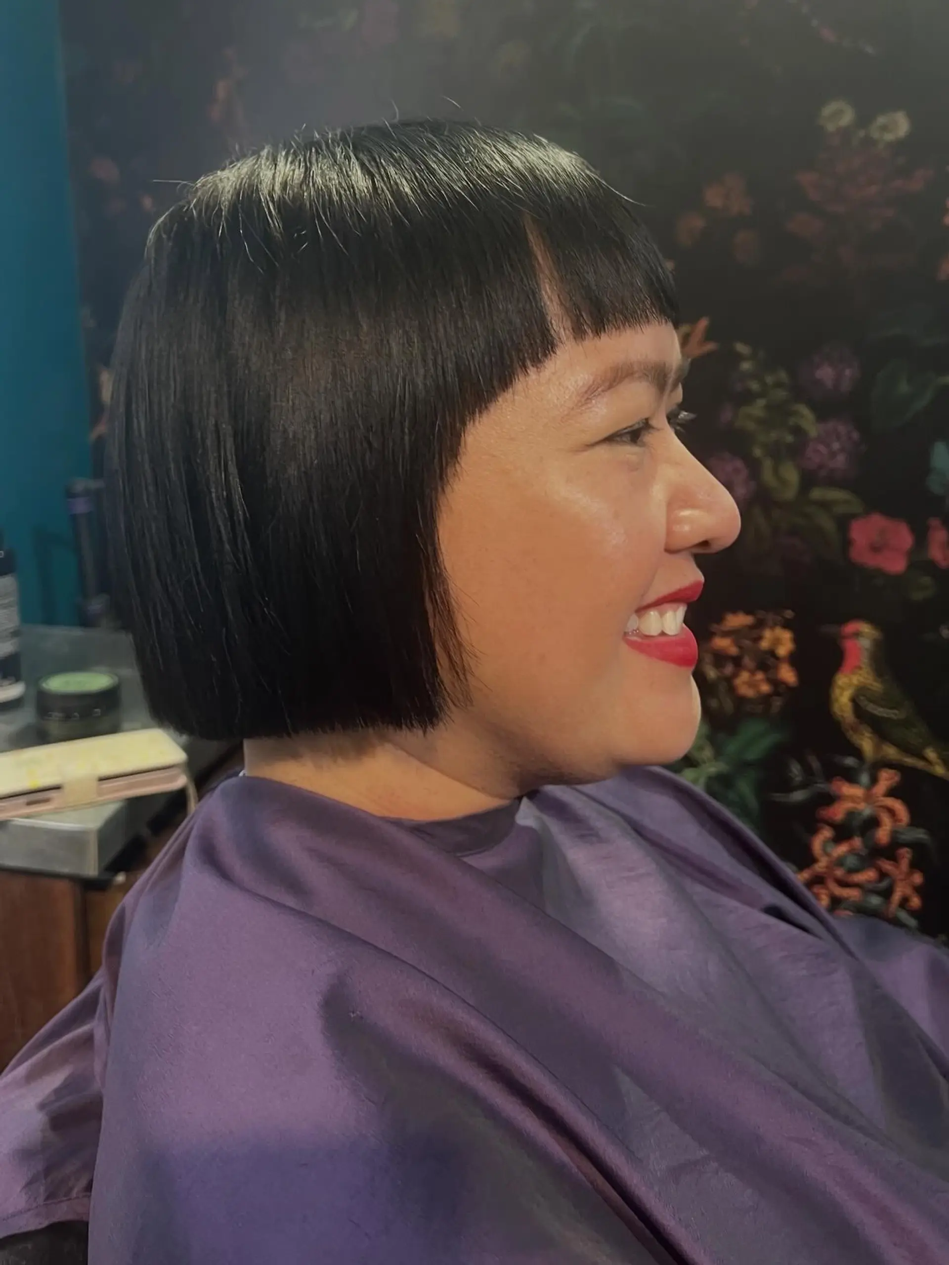 A sleek, chin-length blunt bob haircut paired with straight micro bangs. 1