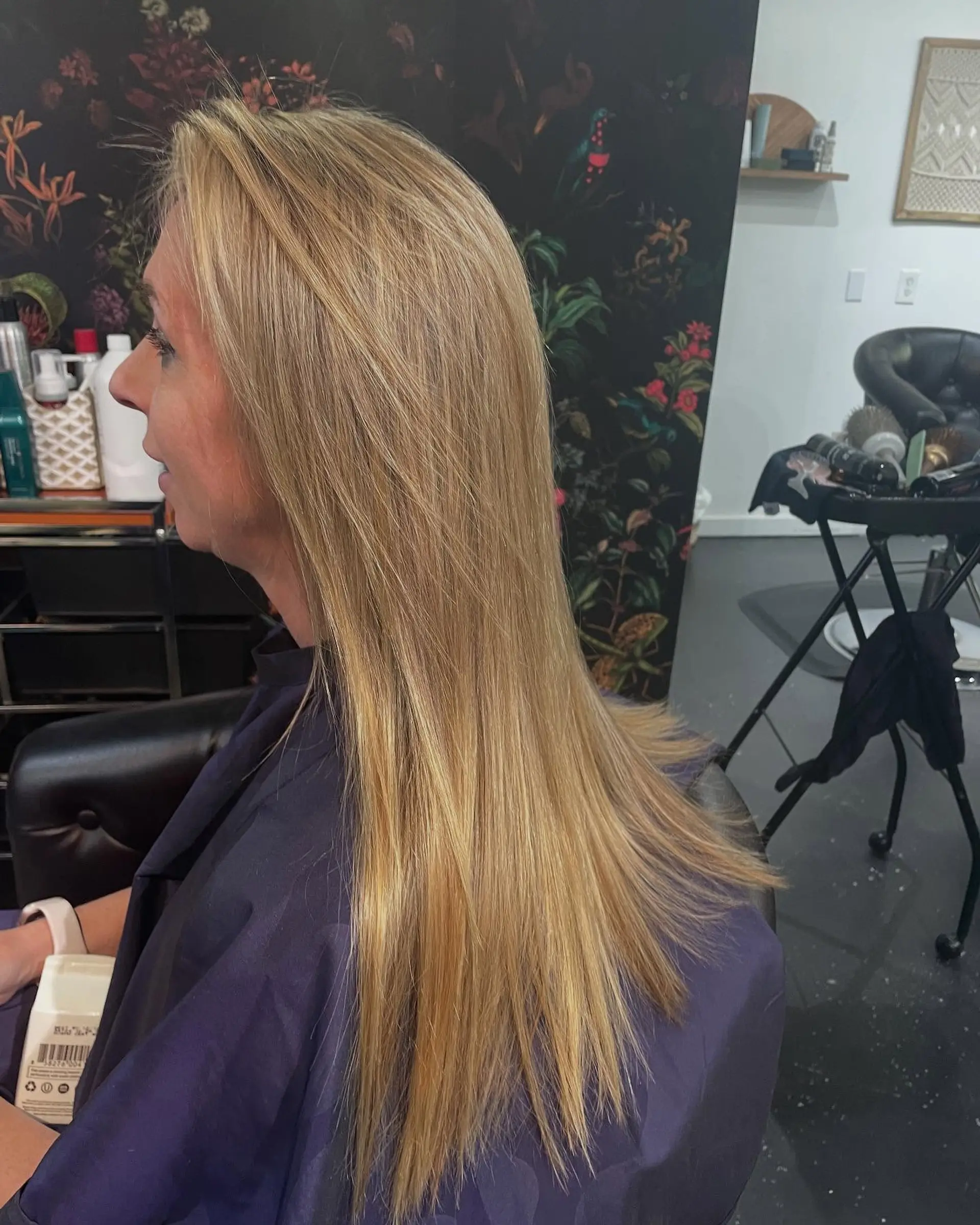 Long straight hair featuring multidimensional golden blonde highlights with a sleek, polished blowout. 1