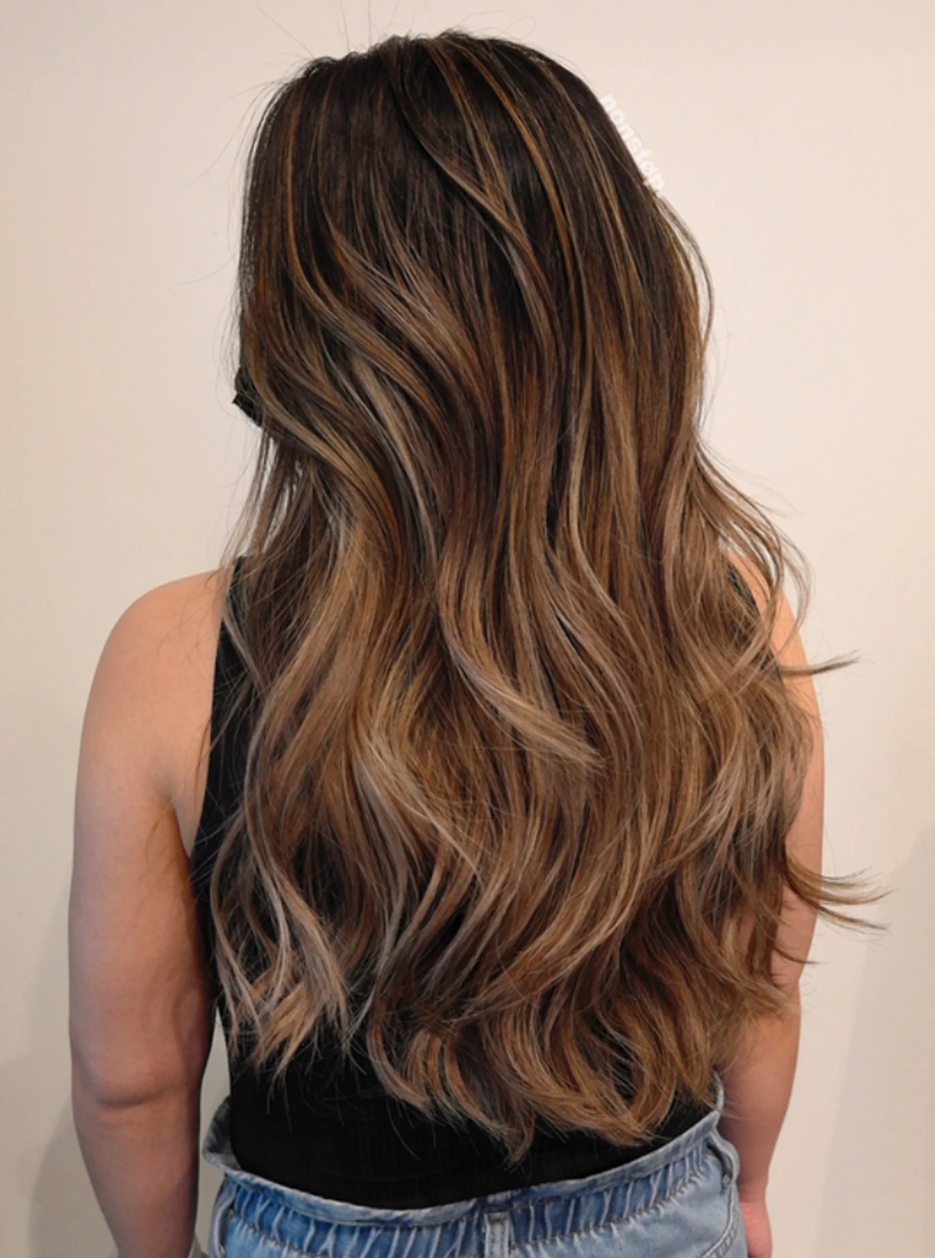 Medium length brunette hair with a dimensional blonde balayage, showcasing the expensive brunette trend - Preview 2