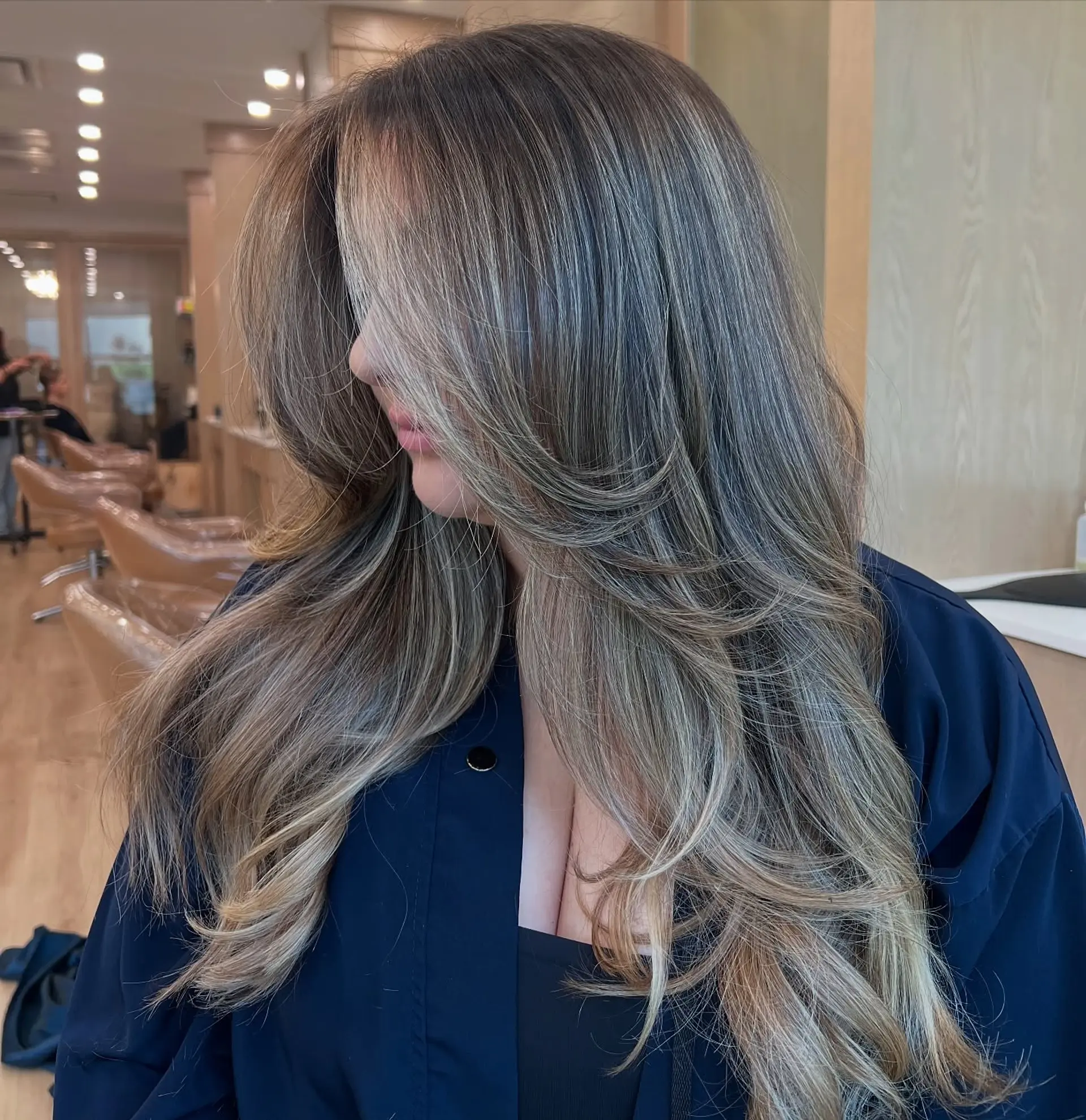Long layered hair with a blended balayage. 1