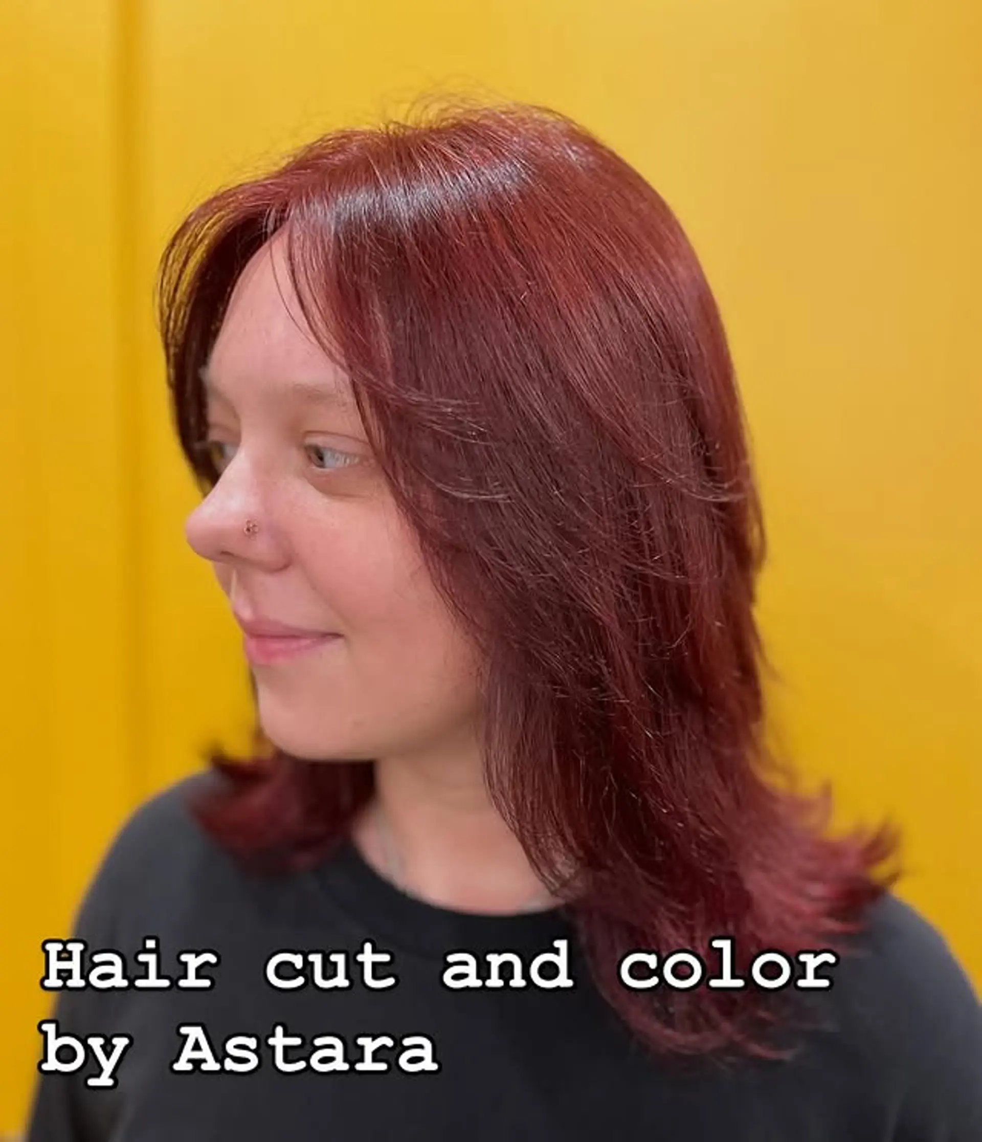 A stylish medium-length haircut with face-framing layers for added dimension and an easy-to-style look. 1