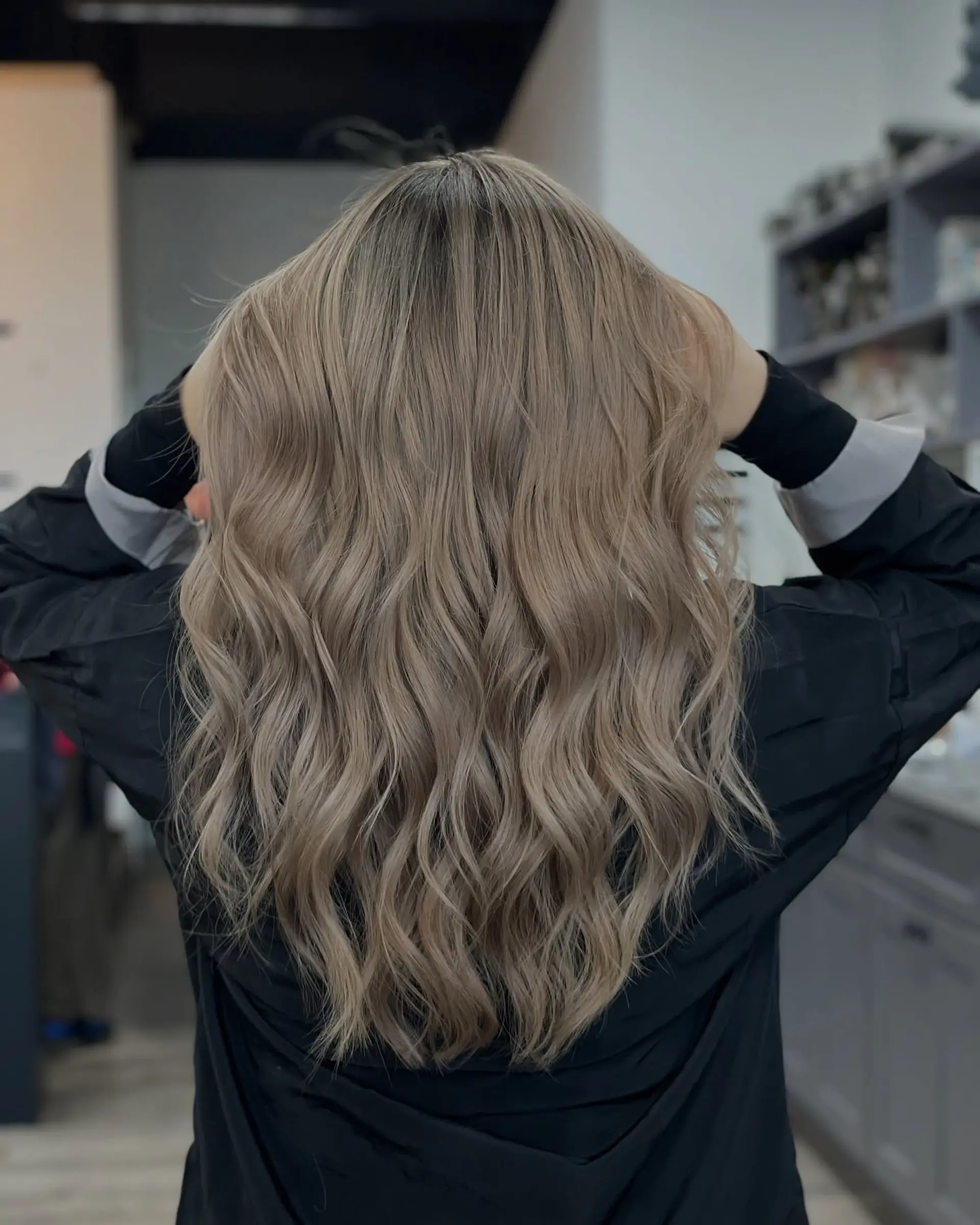 Long wavy hairstyle with a trendy ash blonde balayage. 1