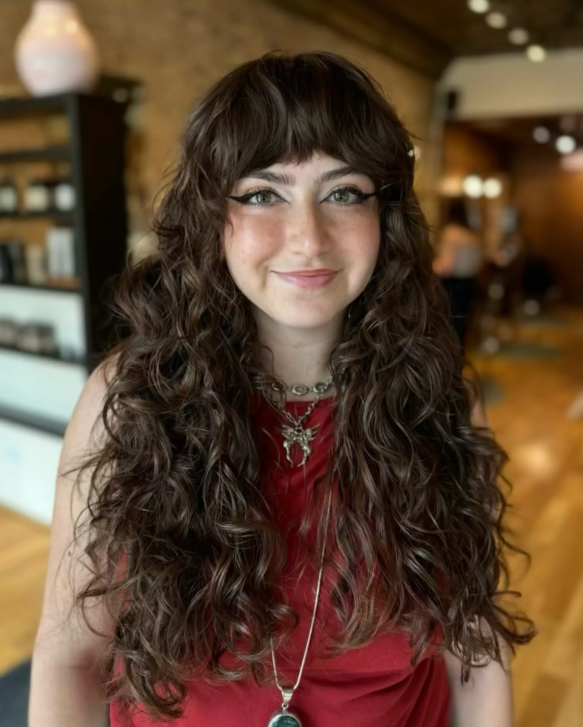 A curly shag with fringed bangs and layered texture. 1