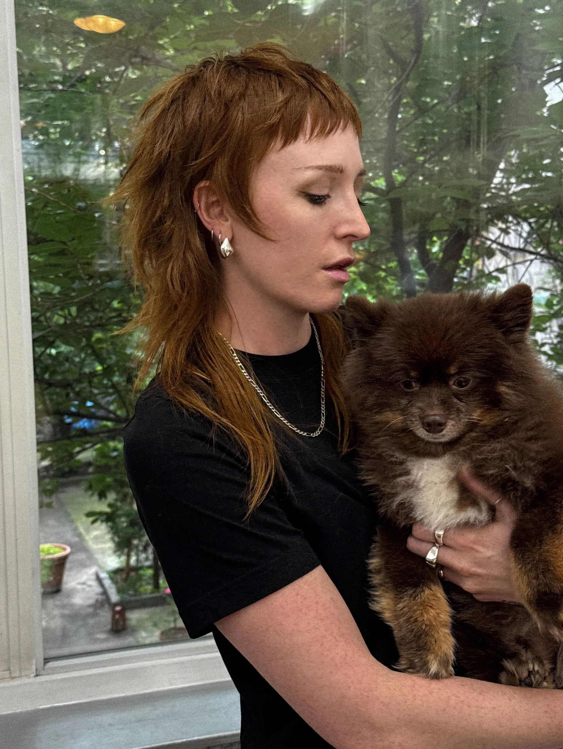 Female model showcasing an edgy modern shag mullet with curtain bangs, reflecting 2025 personal expression trends in NYC. - Preview 1