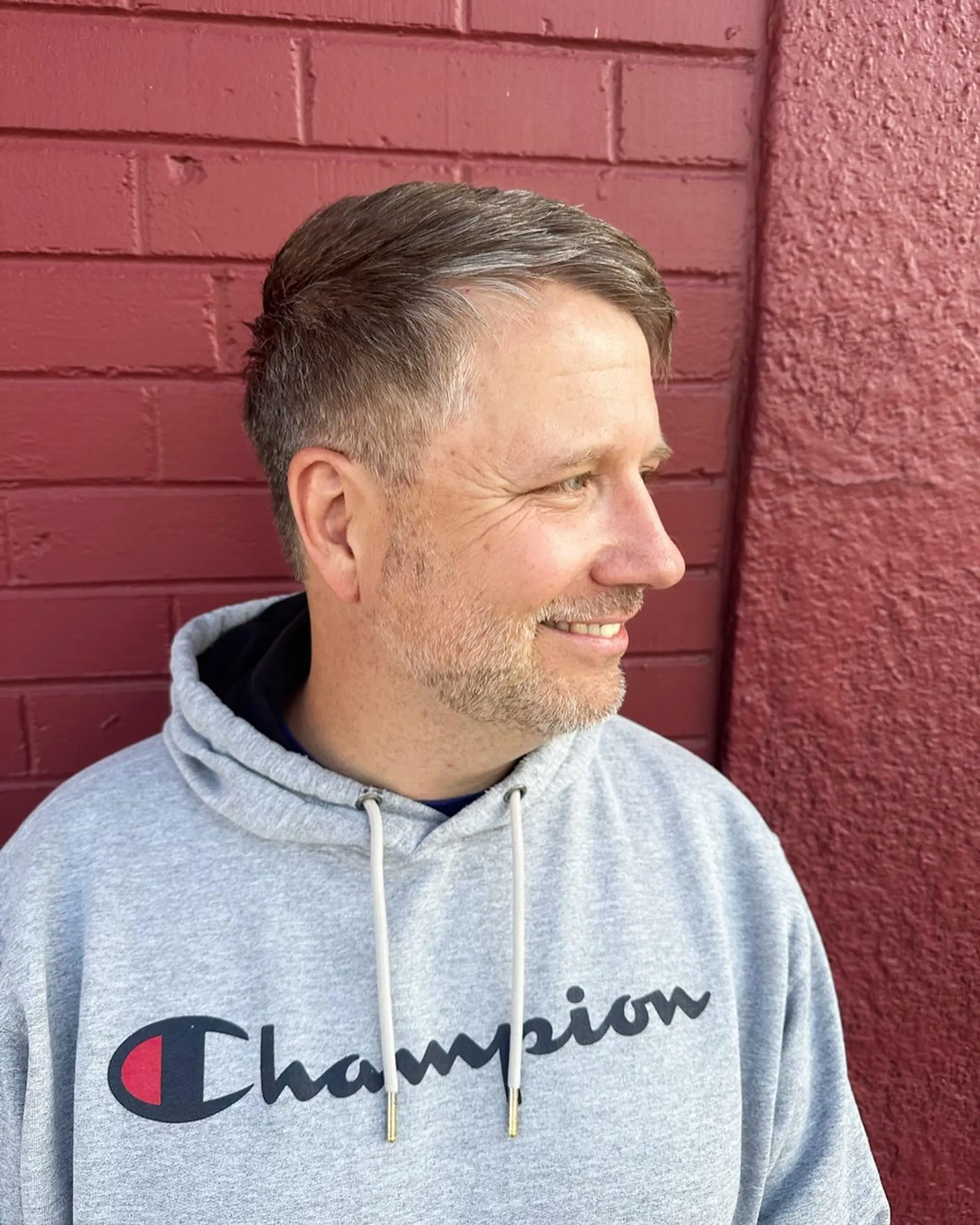 A clean, textured short haircut cut entirely with scissors, featuring softly tapered sides and natural volume on top. 1