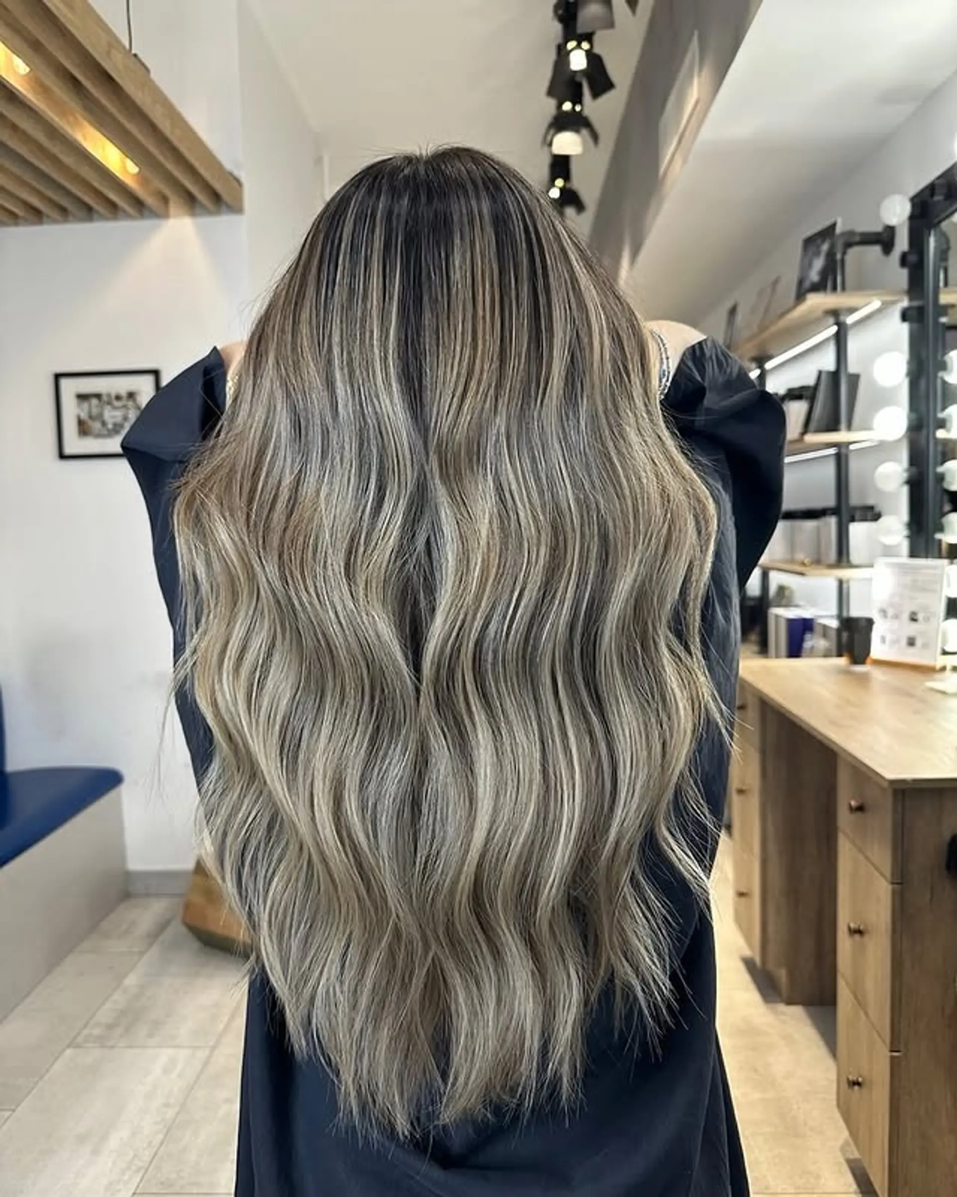 Long, wavy hair with a bronde balayage. 1