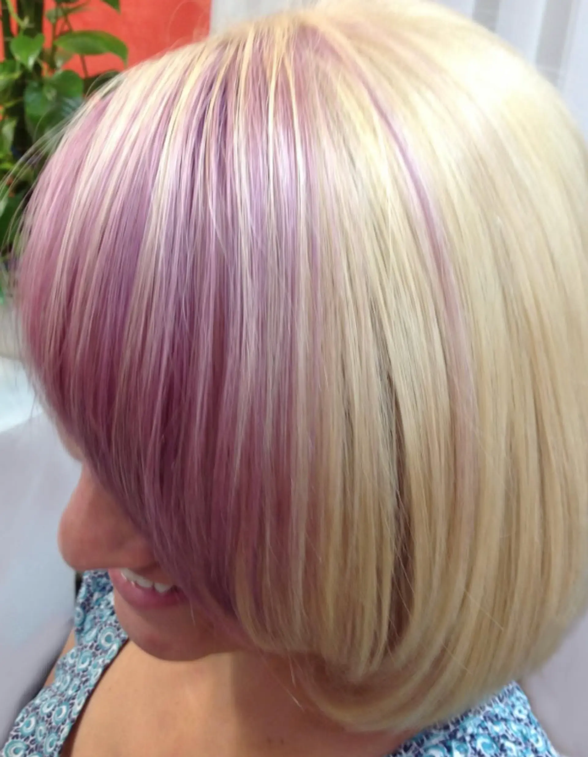 A platinum blonde bob with edgy lilac peekaboo highlights. 1