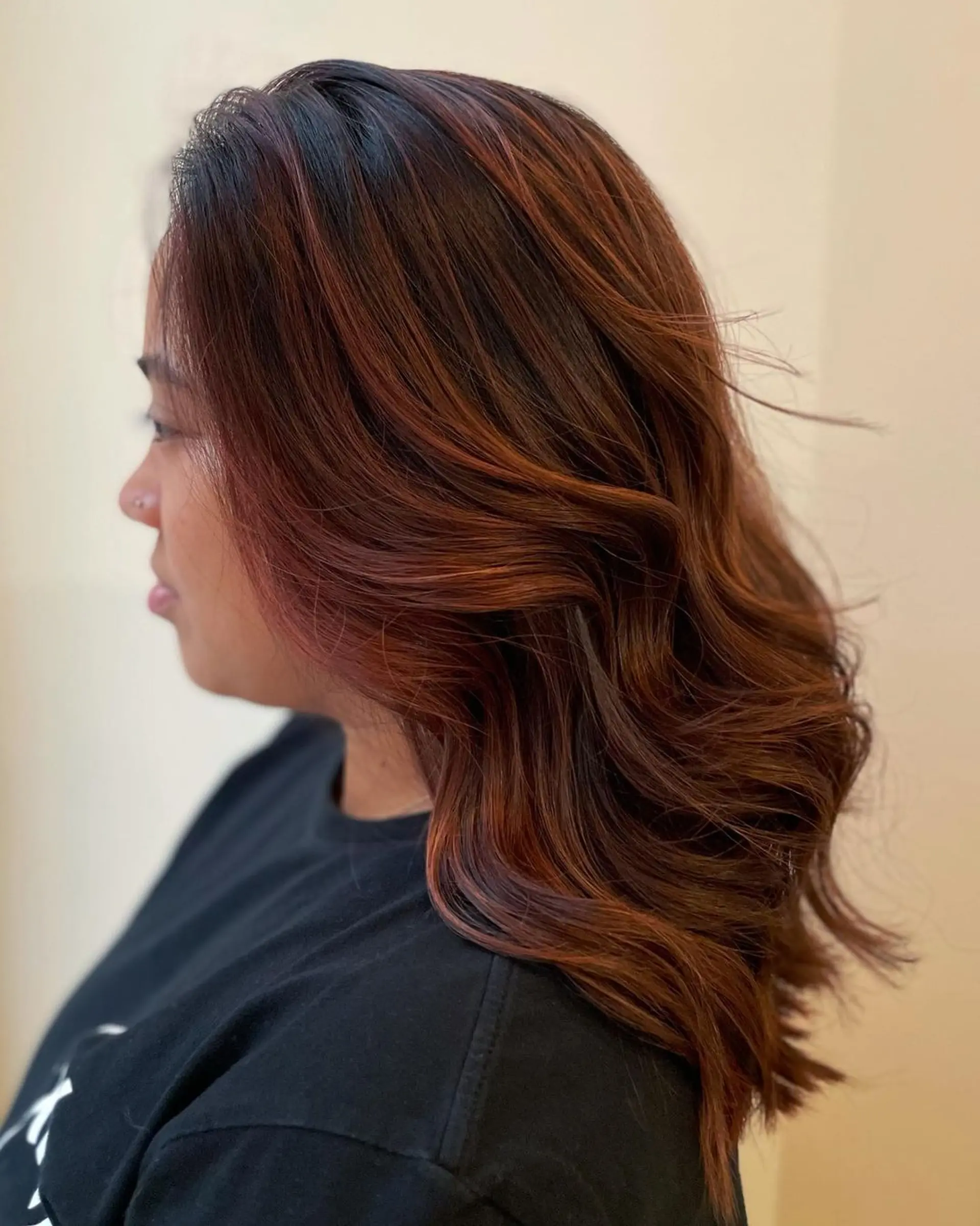 Medium-length wavy hair with a mix of copper, auburn, and rich brown hues, featuring soft waves and subtle layering. 2
