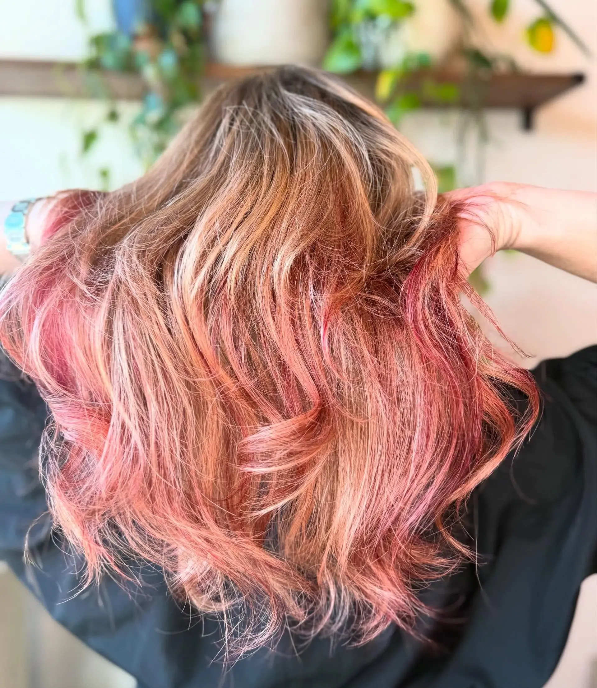 Medium-length textured waves featuring a vibrant blend of blonde and candy cane pink highlights. 1