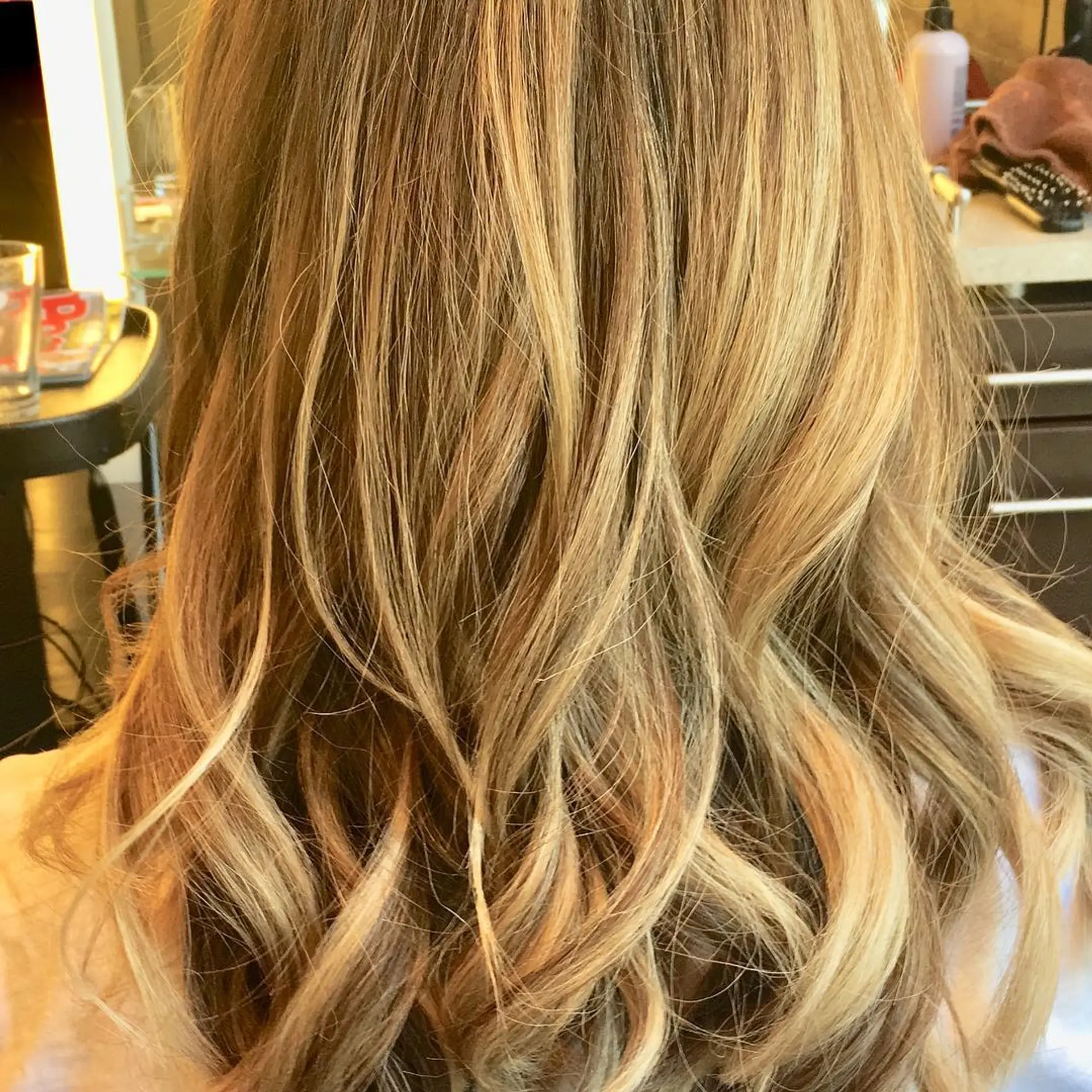 Bronde balayage with soft, natural waves. 2