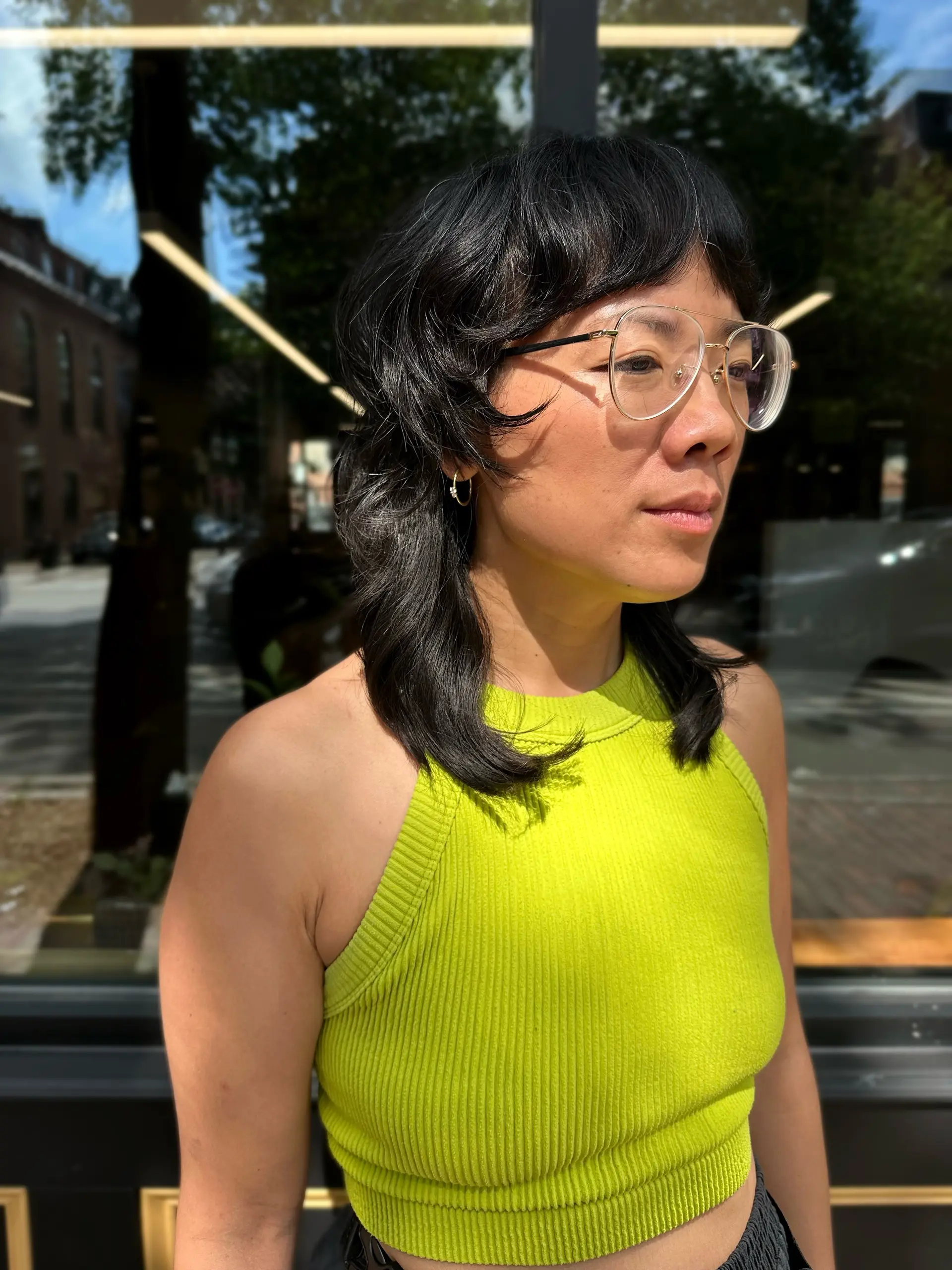 A textured modern mullet-shag hybrid featuring choppy bangs, disconnected face-framing layers, and shoulder-skimming length. 1