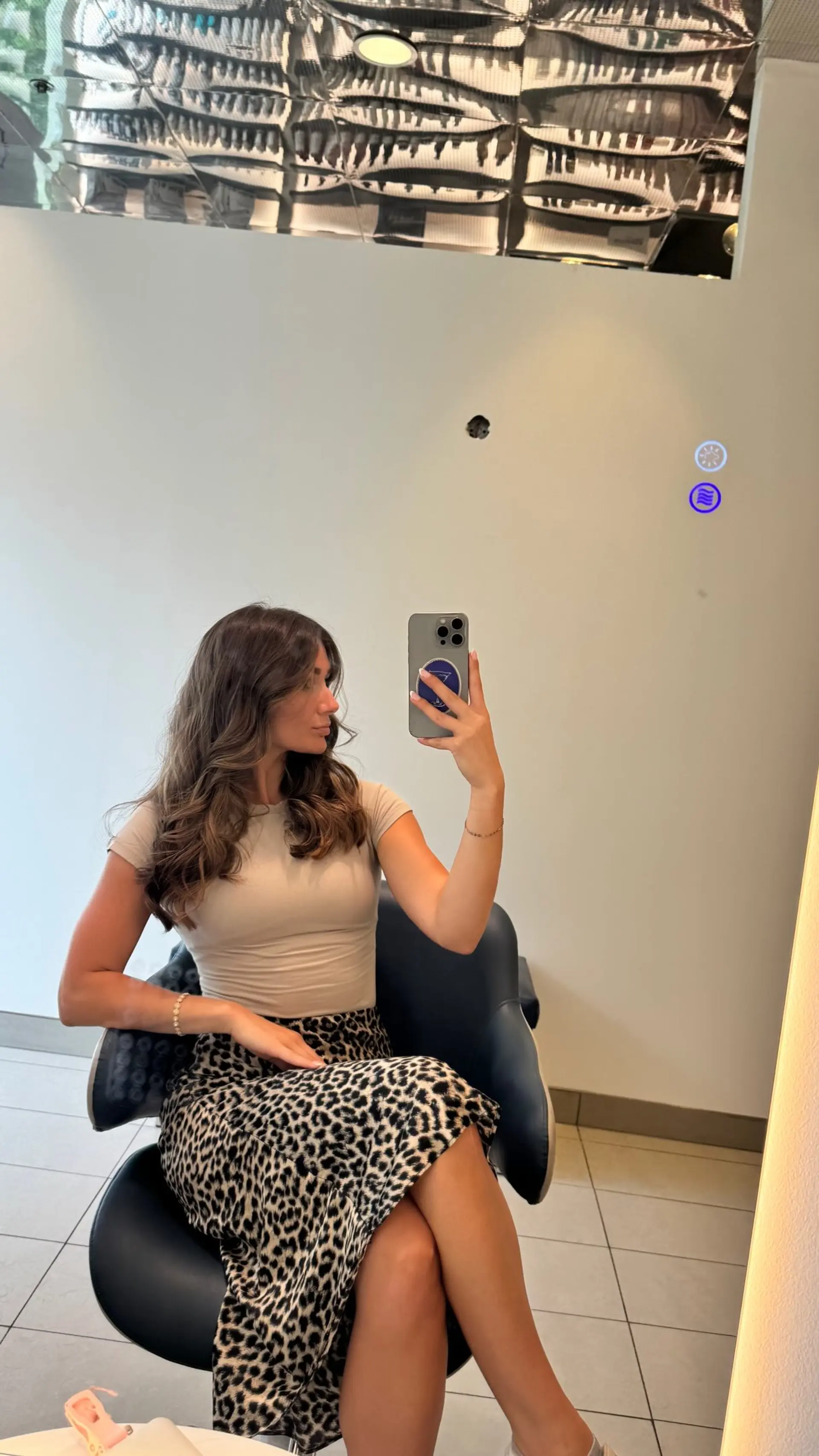 Long brunette hair styled in a bouncy, voluminous blowout with soft face-framing waves. 1