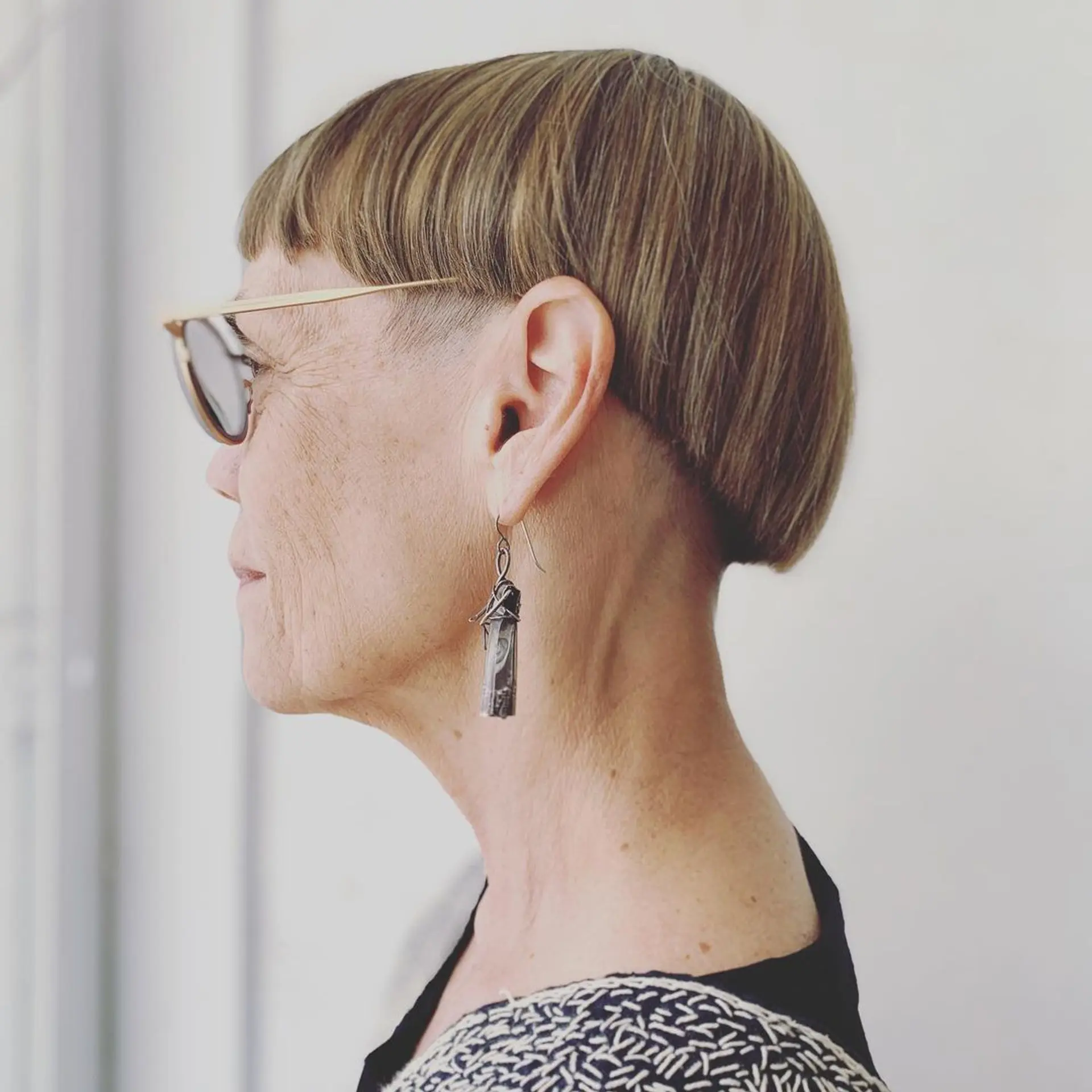 A short, straight bob with a blunt fringe and a clean finish, exuding a modern yet retro charm. 1