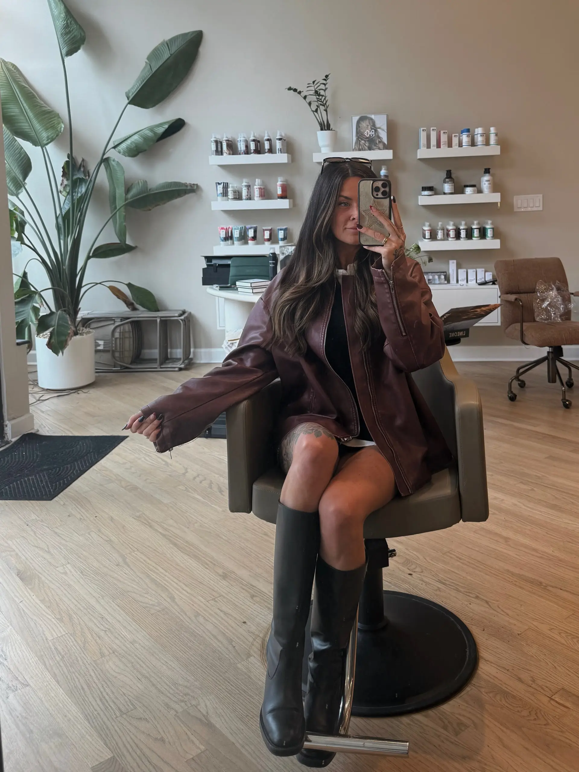 Long dark brown hair styled with soft, cascading waves and a sleek center part. 1