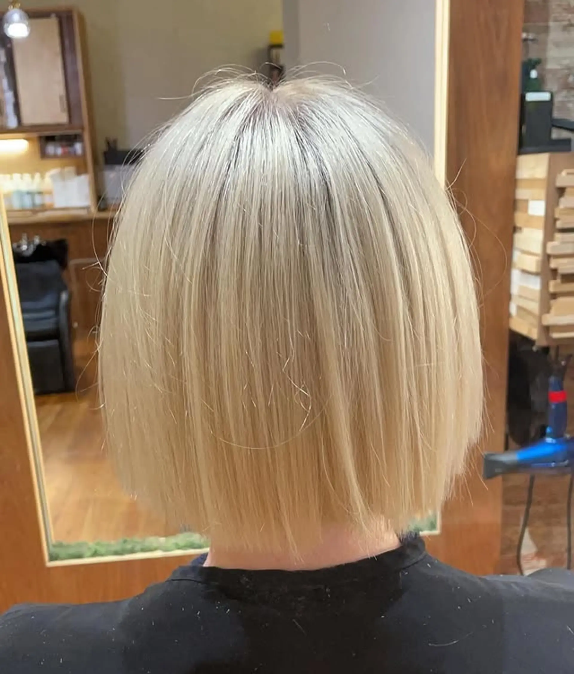 A short, straight, blunt bob cut. 1