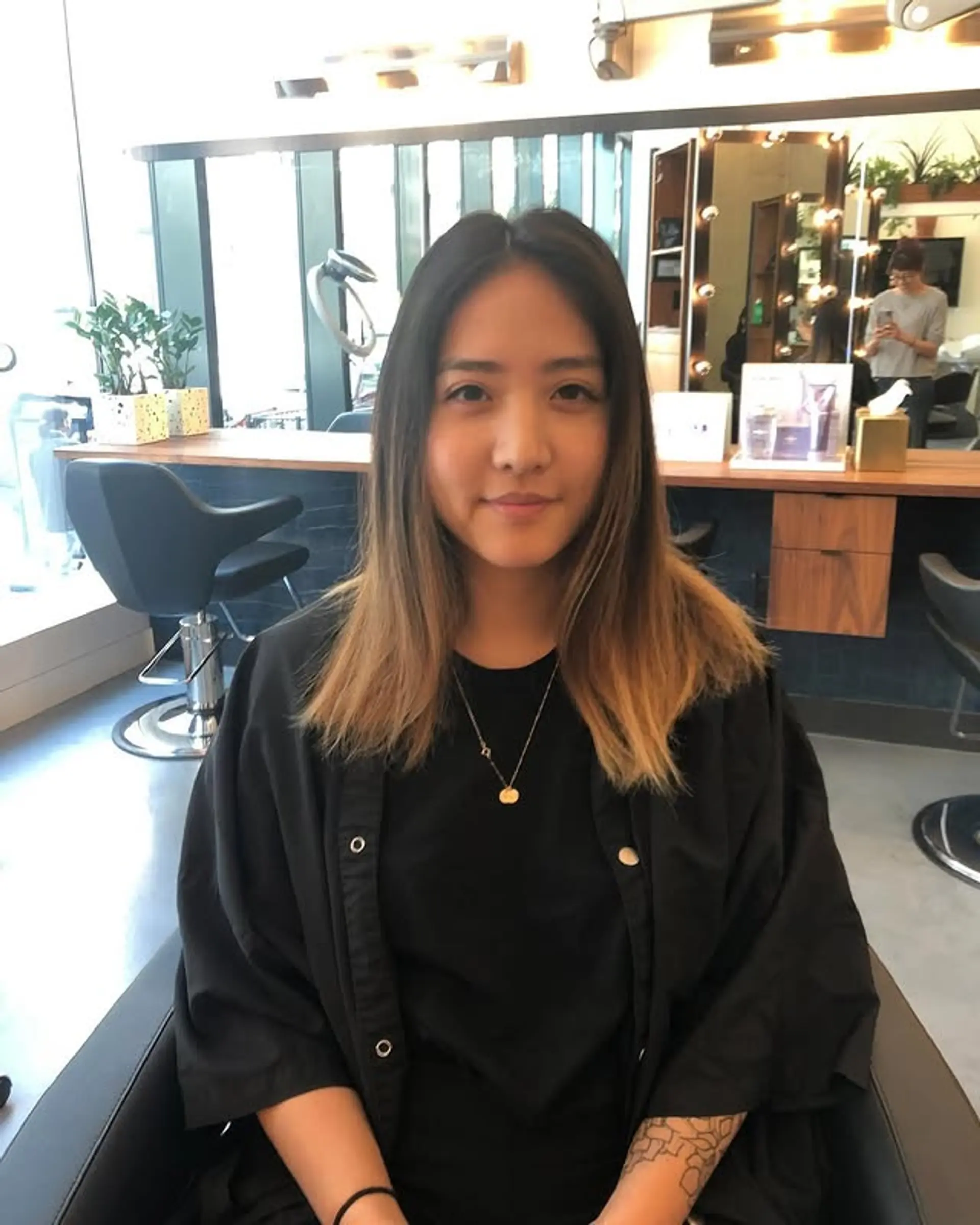 A medium length layered hairstyle with a subtle ombre effect. 1