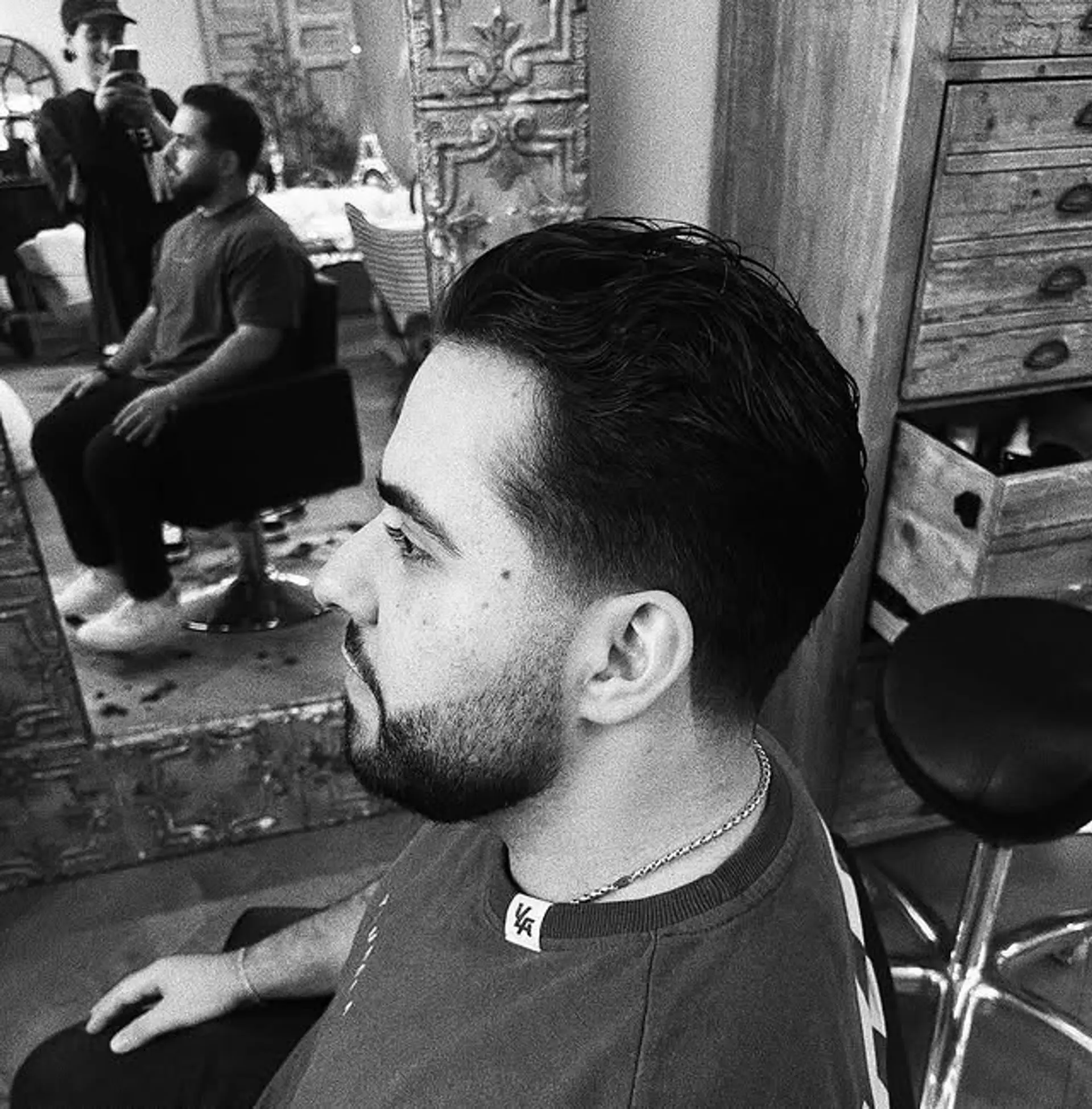 A classic short taper haircut with a textured top. 1