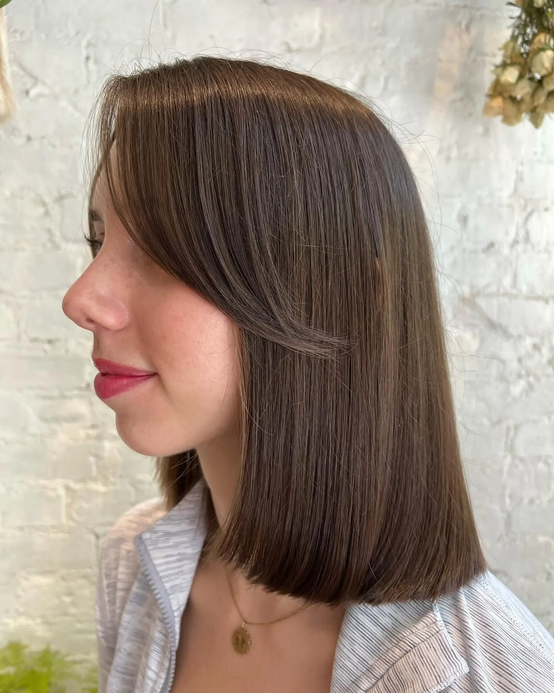 A sleek lob with subtle face-framing bangs. 2