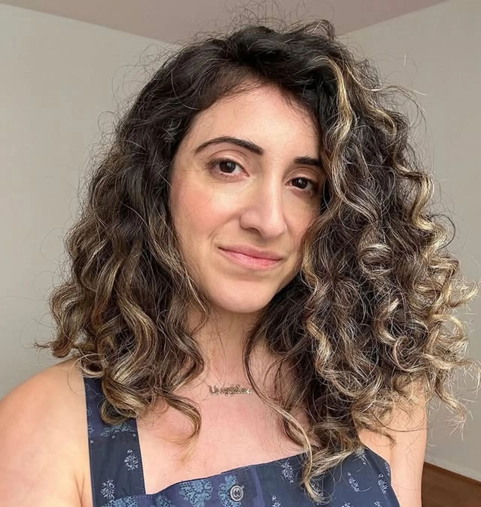 Medium-length layered curls with bronde balayage and face-framing highlights. 1