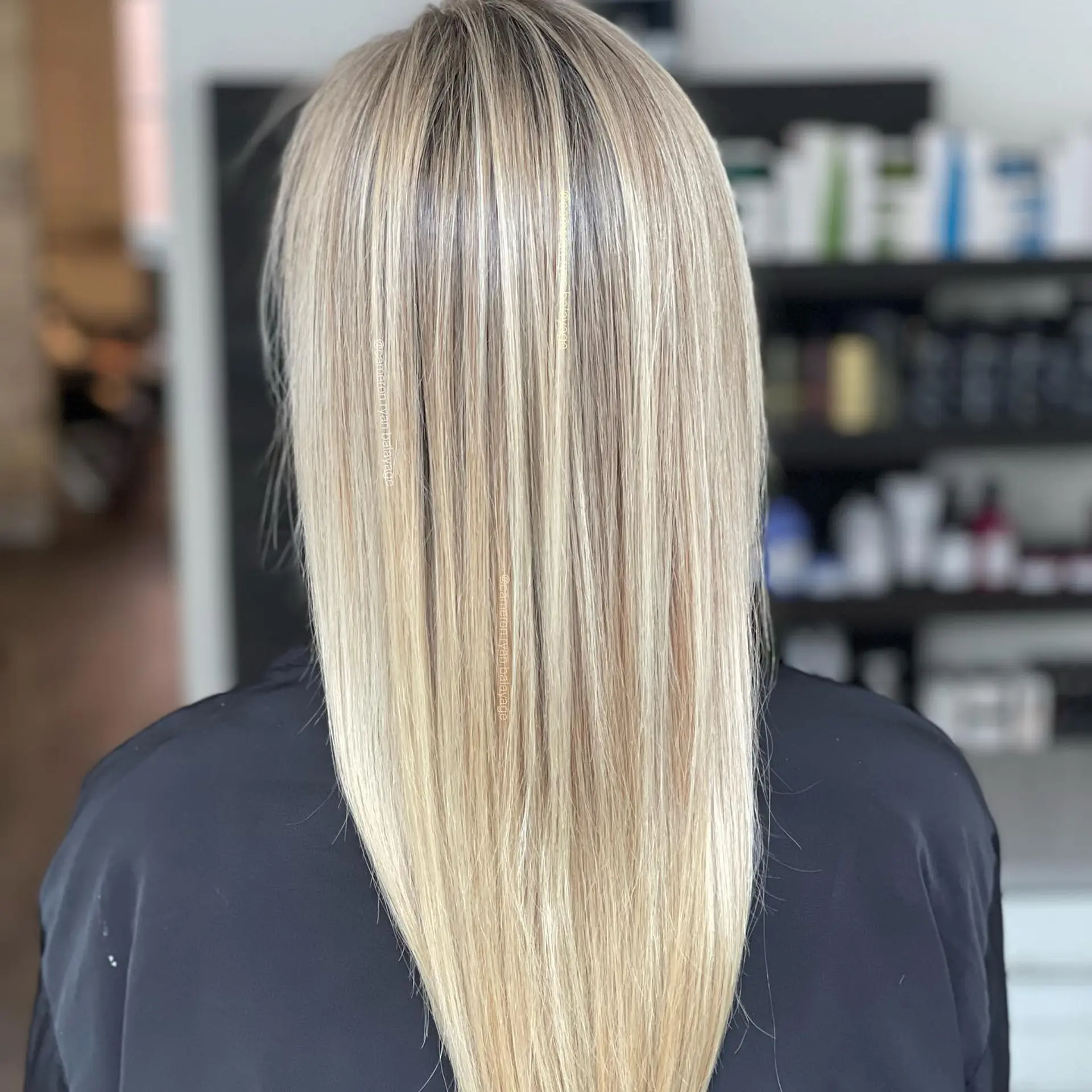 Long straight hair styled with seamless, finely woven blonde foil highlights over a soft natural base. 1