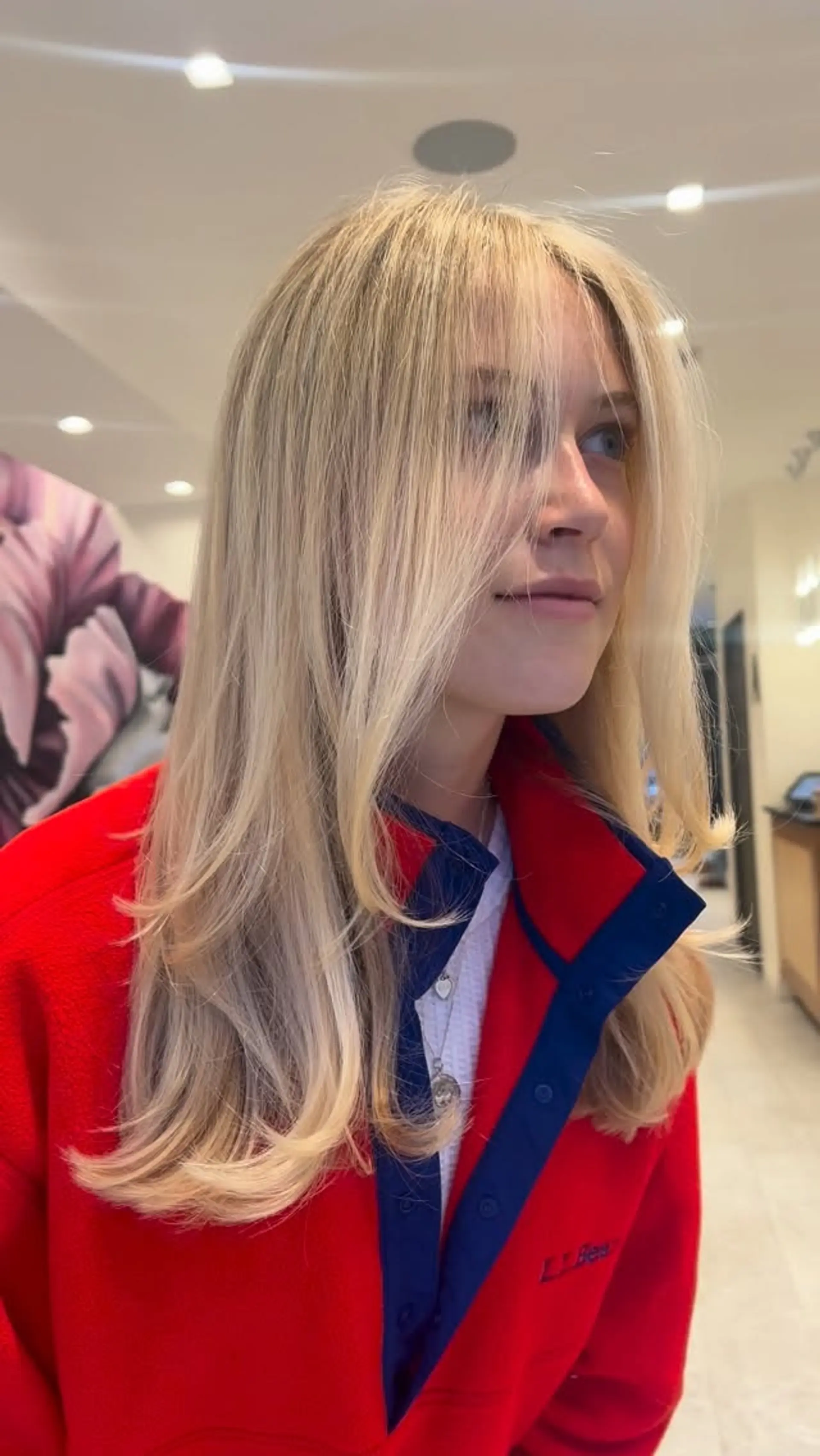 Bright dimensional blonde styled with long face-framing layers and soft curved ends. 1