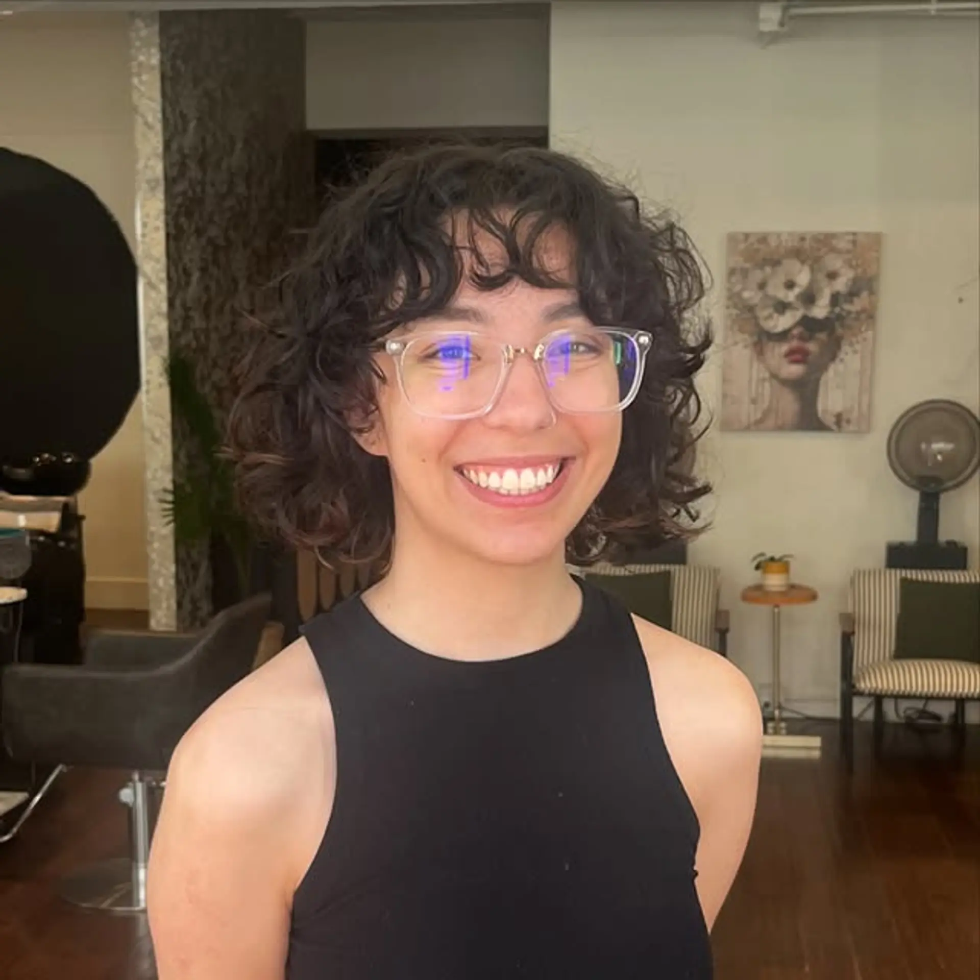 A modern shag haircut with curly bangs and layers for added texture and volume. 1