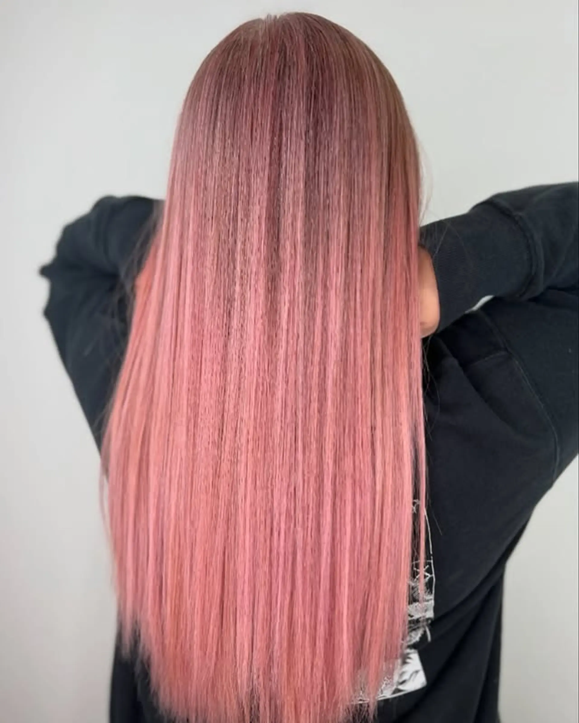 Very long, straight hair with a millennial pink color and a glossy finish. 1