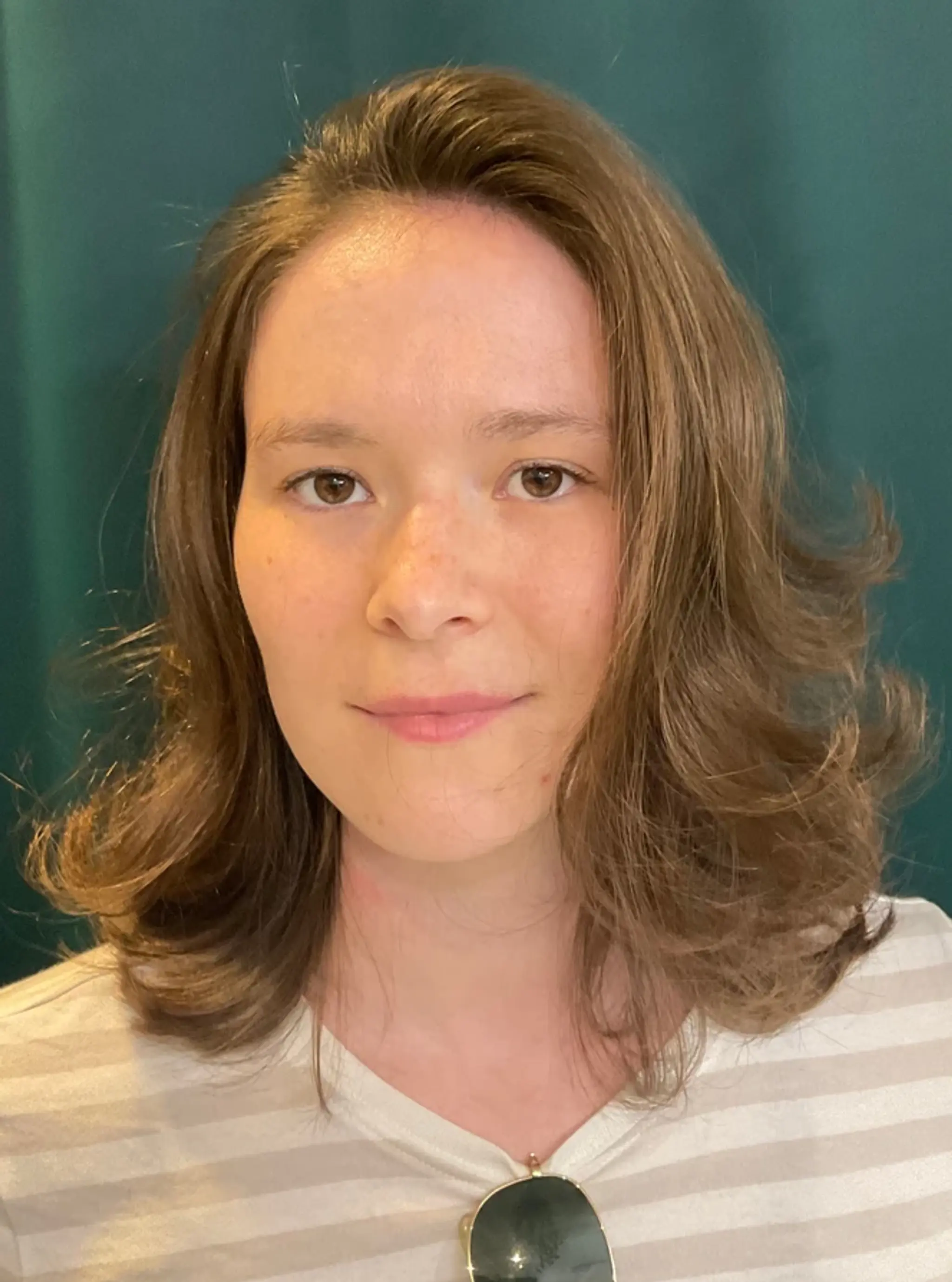 Medium-length, light brown waves with a natural, effortless flow, offering a casual and relaxed look.