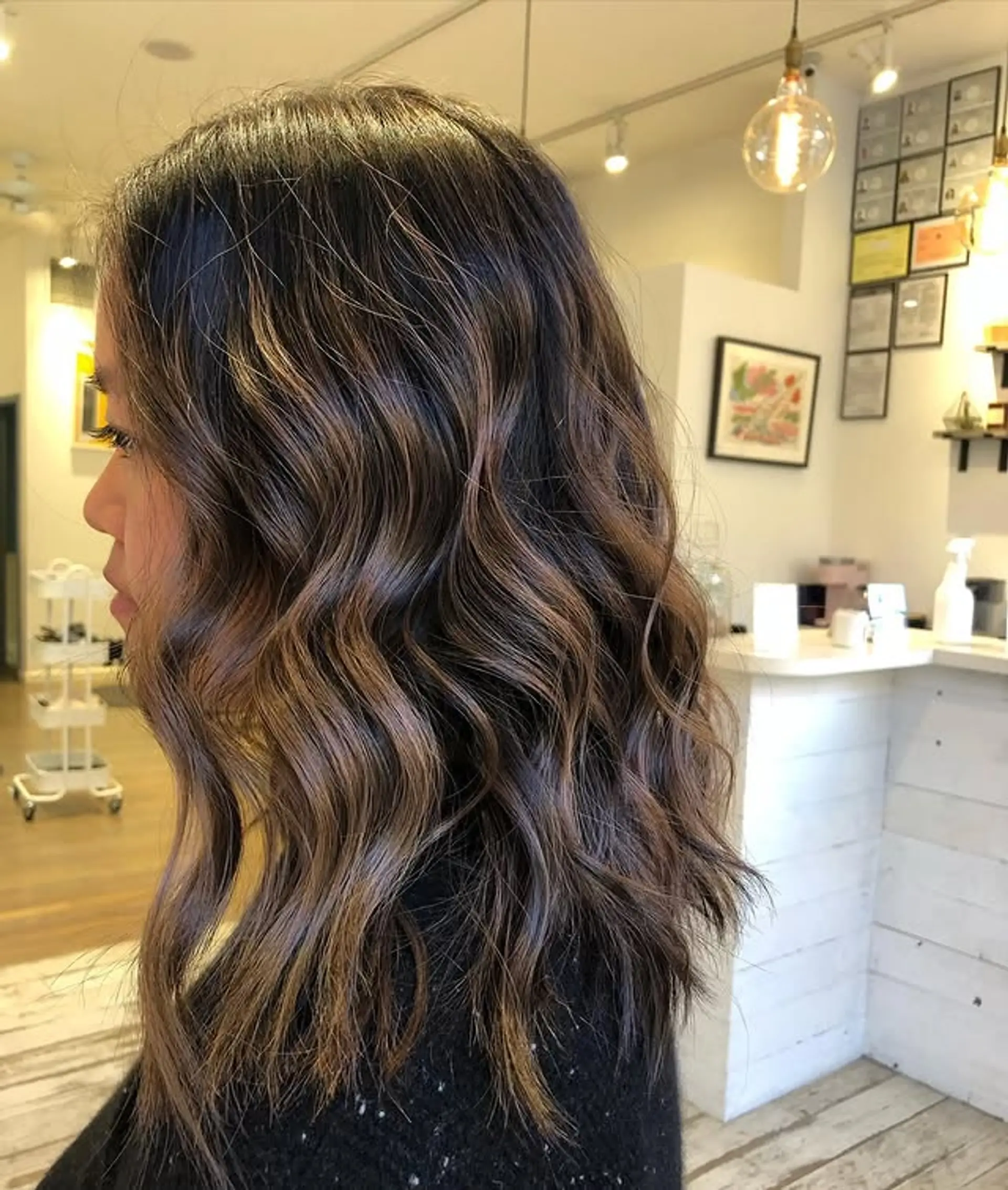 A medium-length wavy lob with bronzed balayage highlights. 1