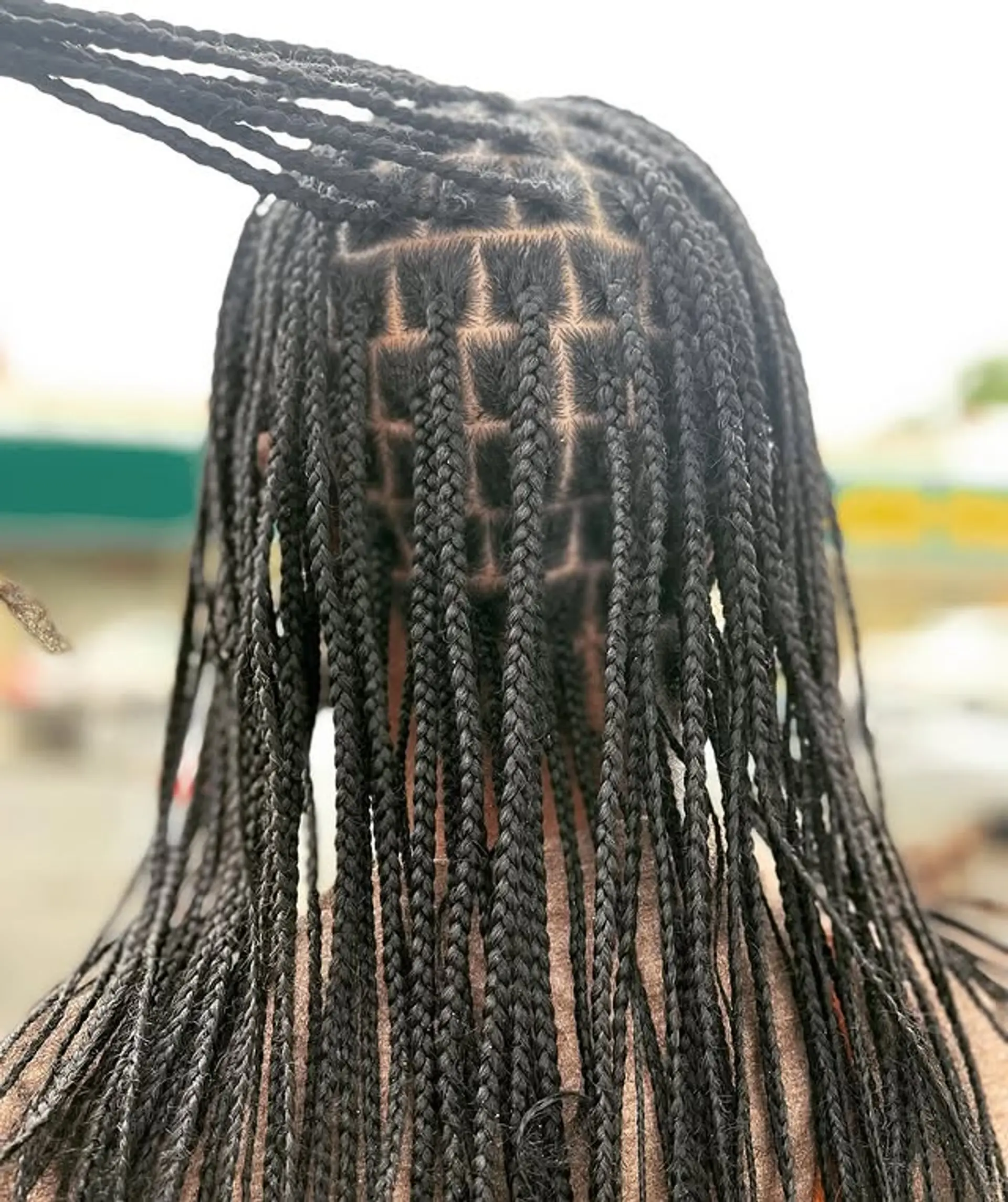 Knotless box braids provide a sleek and protective hairstyle with a seamless transition from the natural hair to the braids. 1