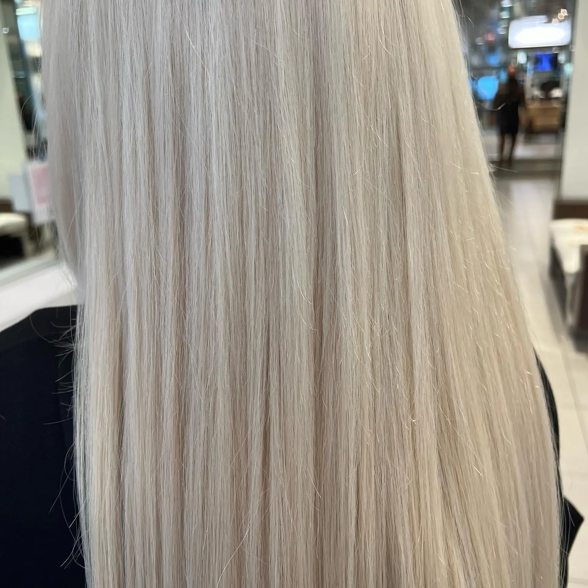 Long, sleek straight hair finished in an ultra-cool platinum blonde tone. 1