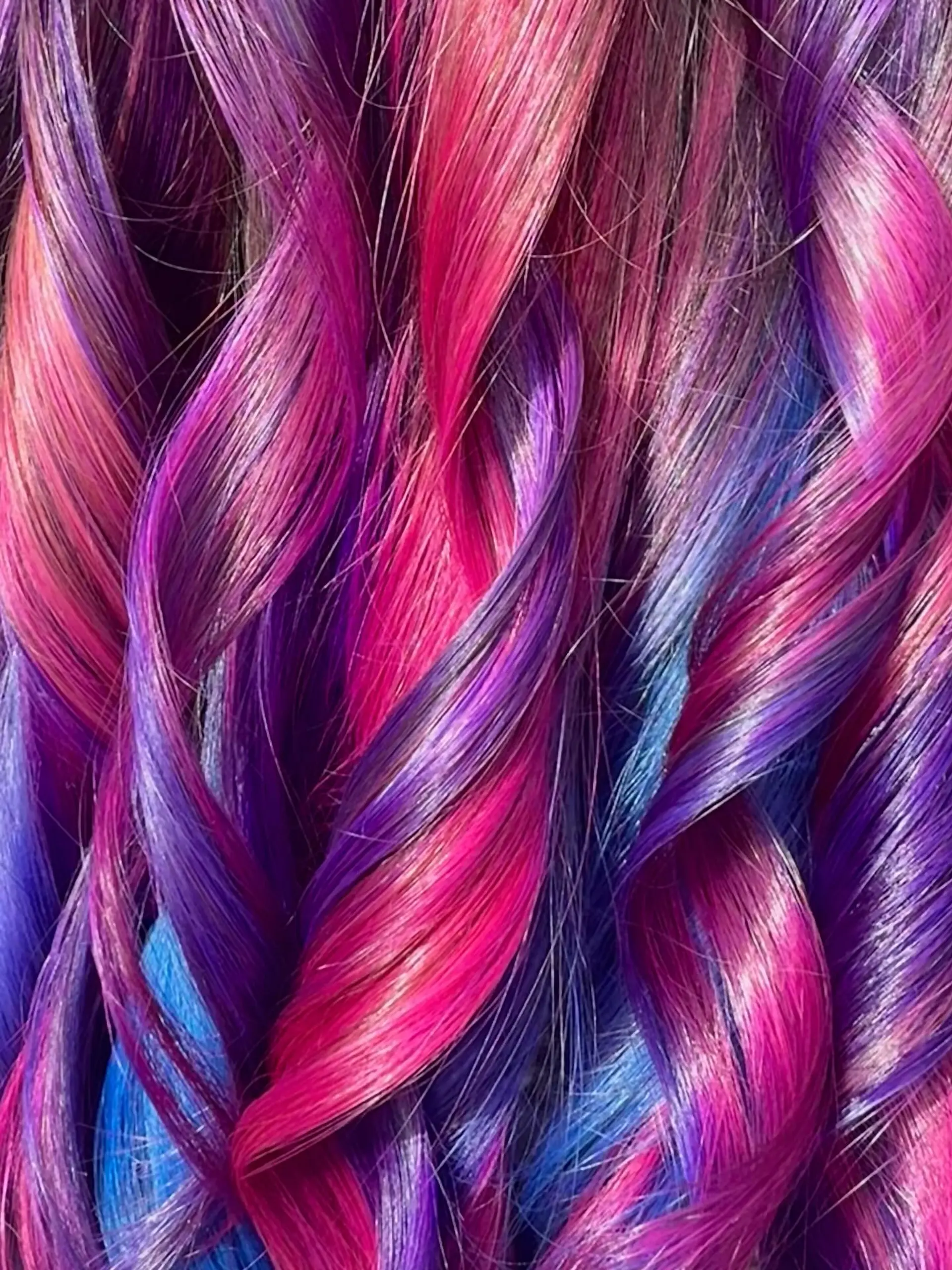 Vibrant, high-shine spiral curls showcasing a multi-tonal blend of hot pink, magenta, rich purple, and vivid blue. 1