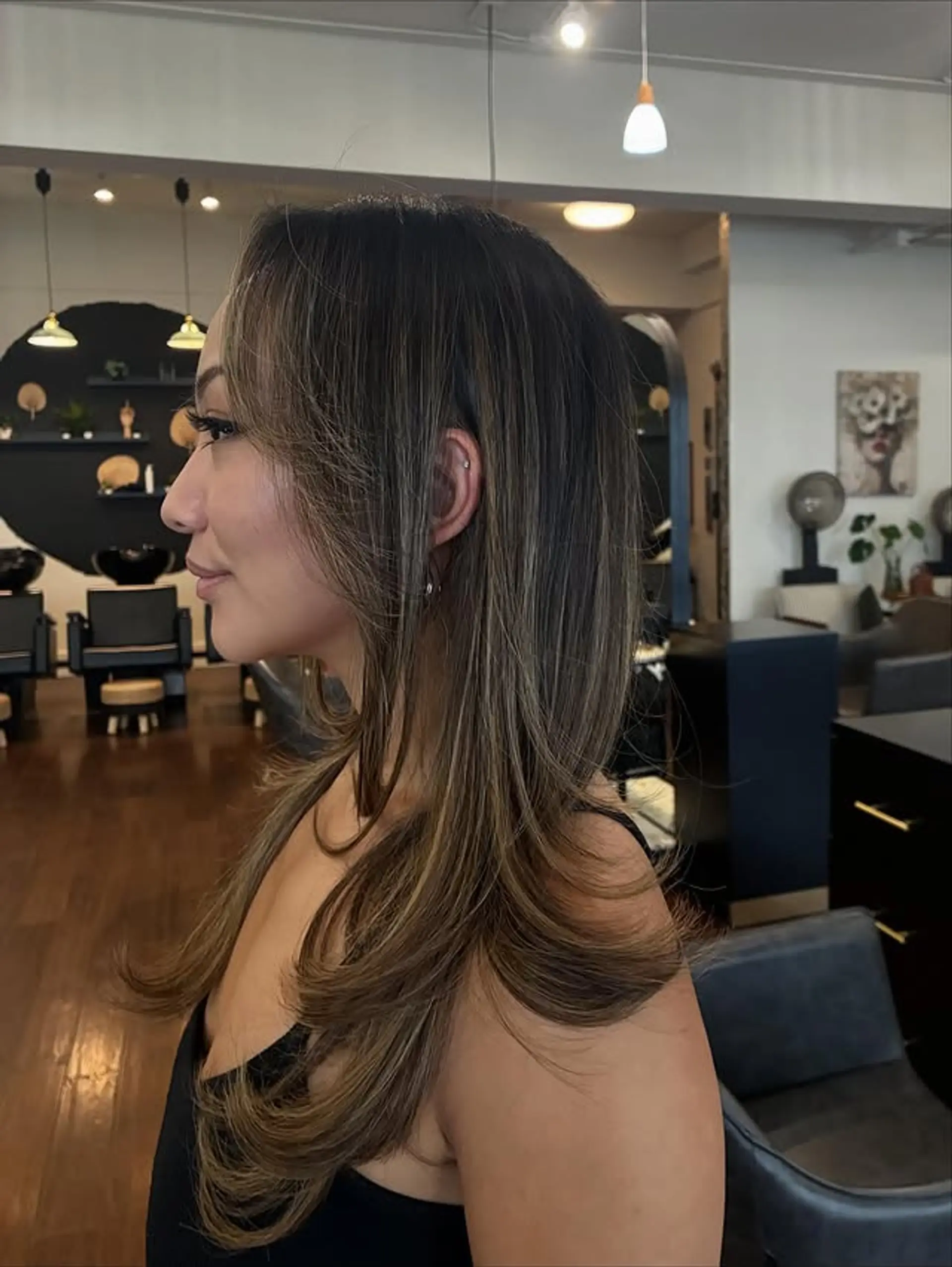 A layered lob with soft, face-framing layers and a modern color melt. 1