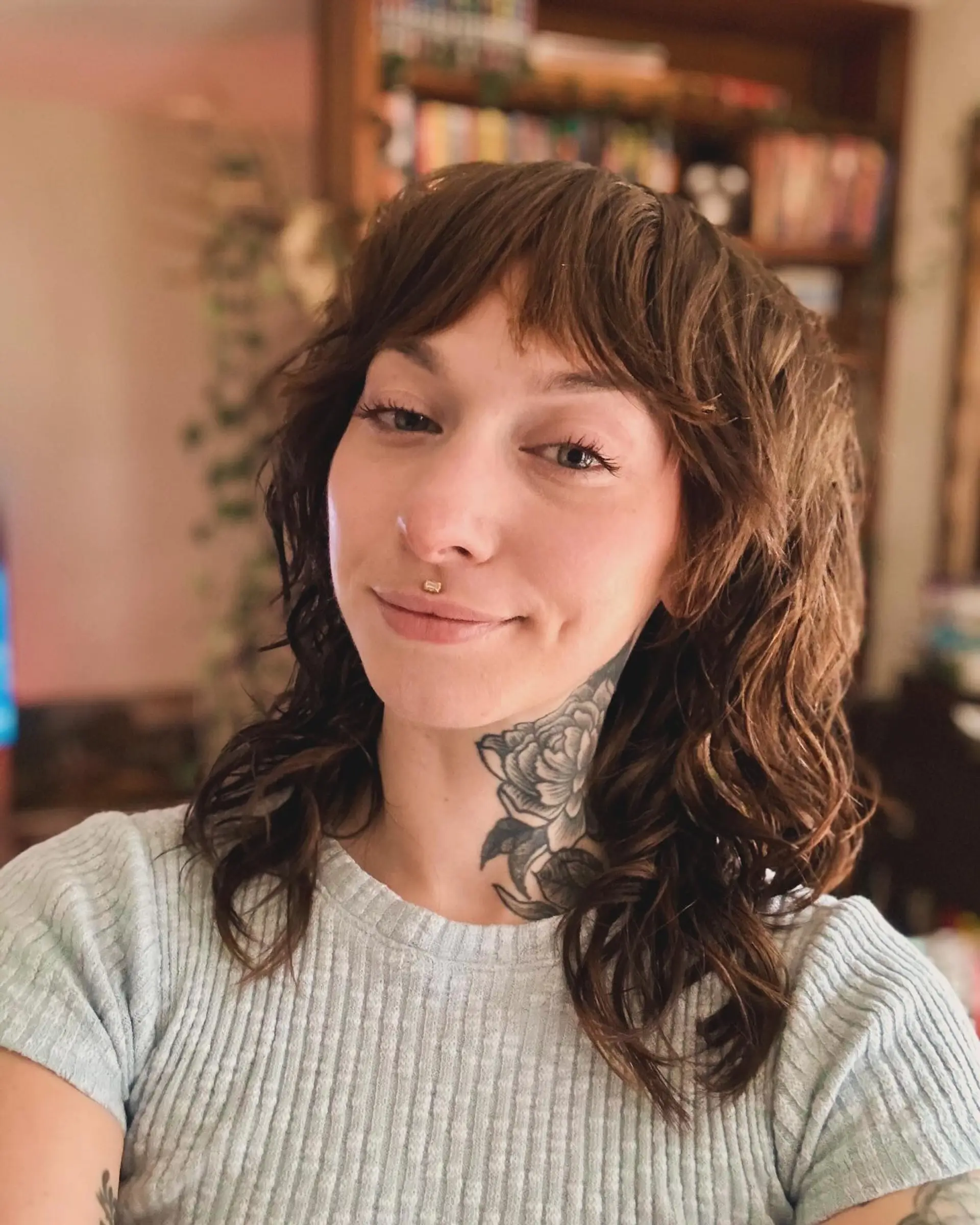 A medium-length shag with face-framing layers and stylish curtain bangs. 1