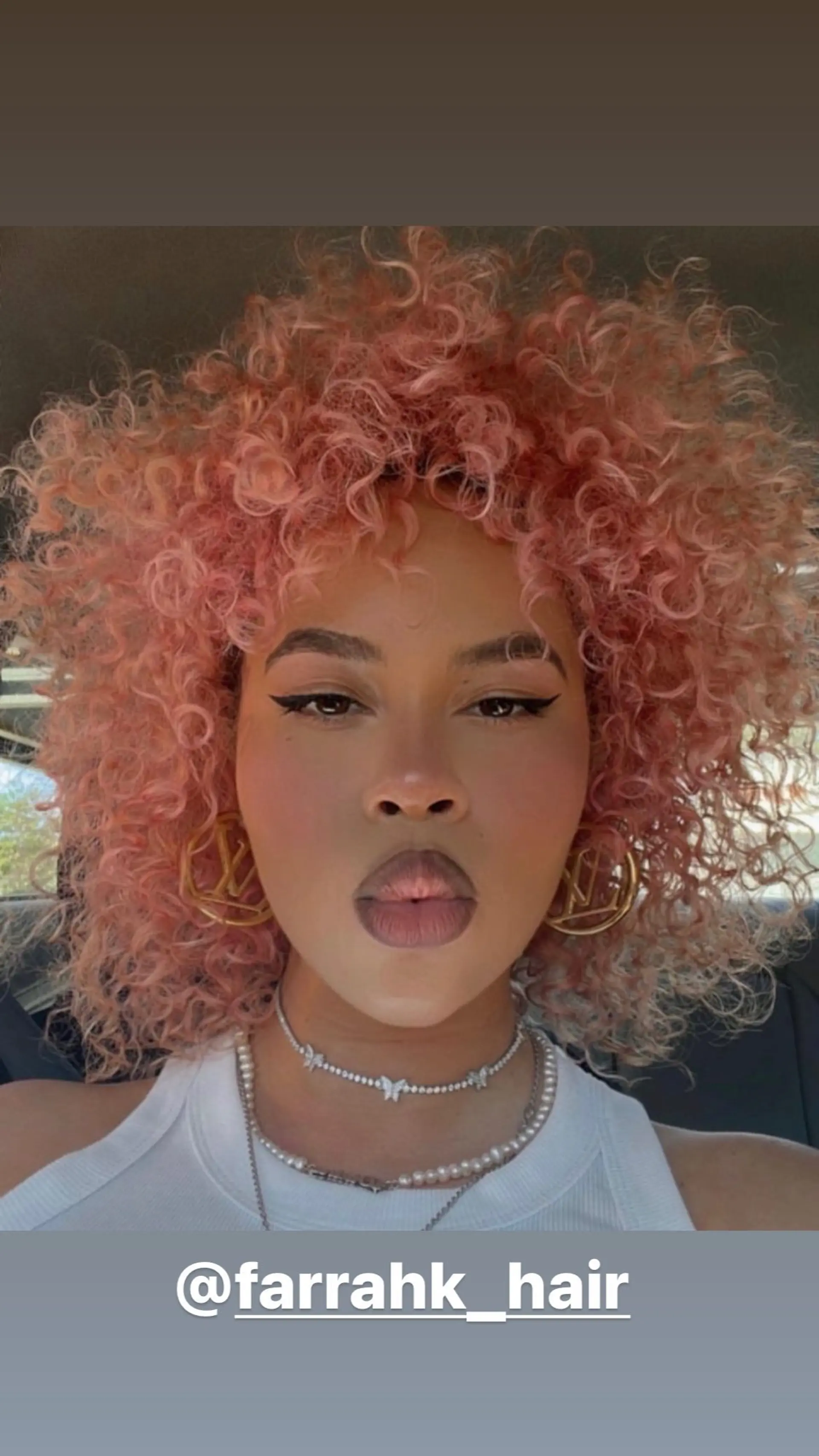 A curly bob haircut with defined curls. 1