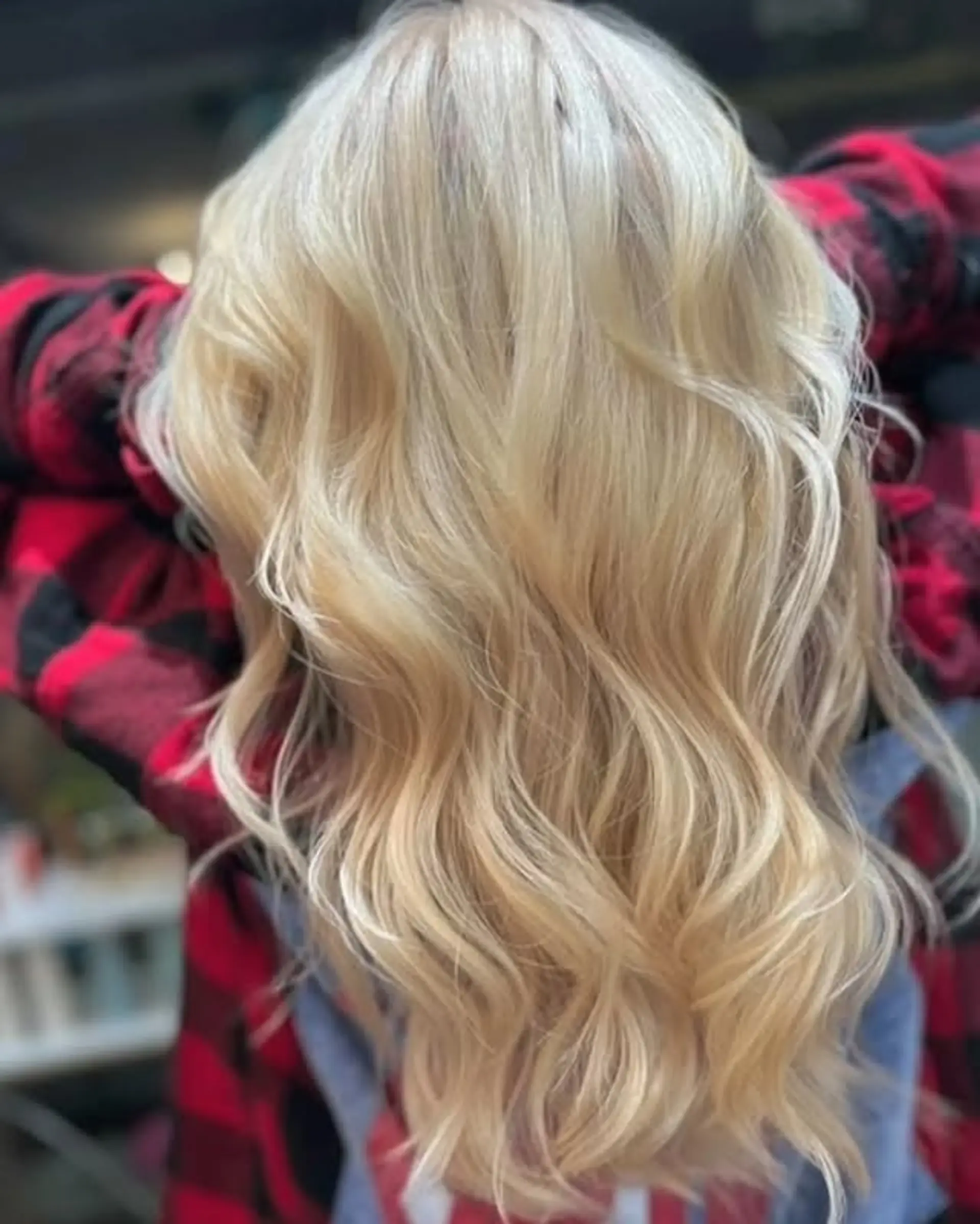 Long, layered wavy hairstyle with soft, beachy waves. 1