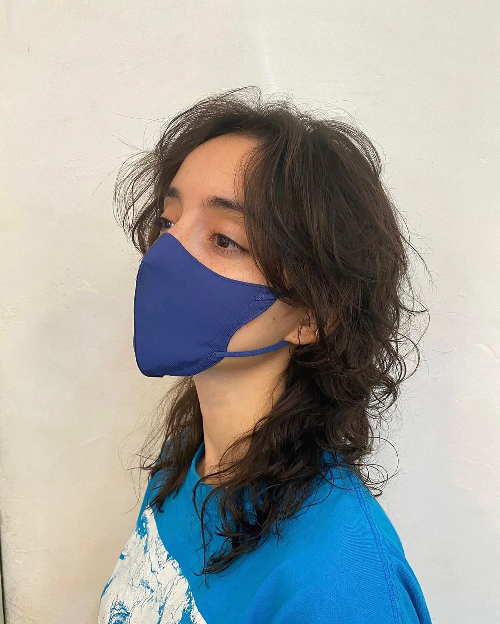 Medium-length, wavy dark brown hair, layered into a shaggy, face-framing style with natural, tousled waves. (Hair by Coco) 2