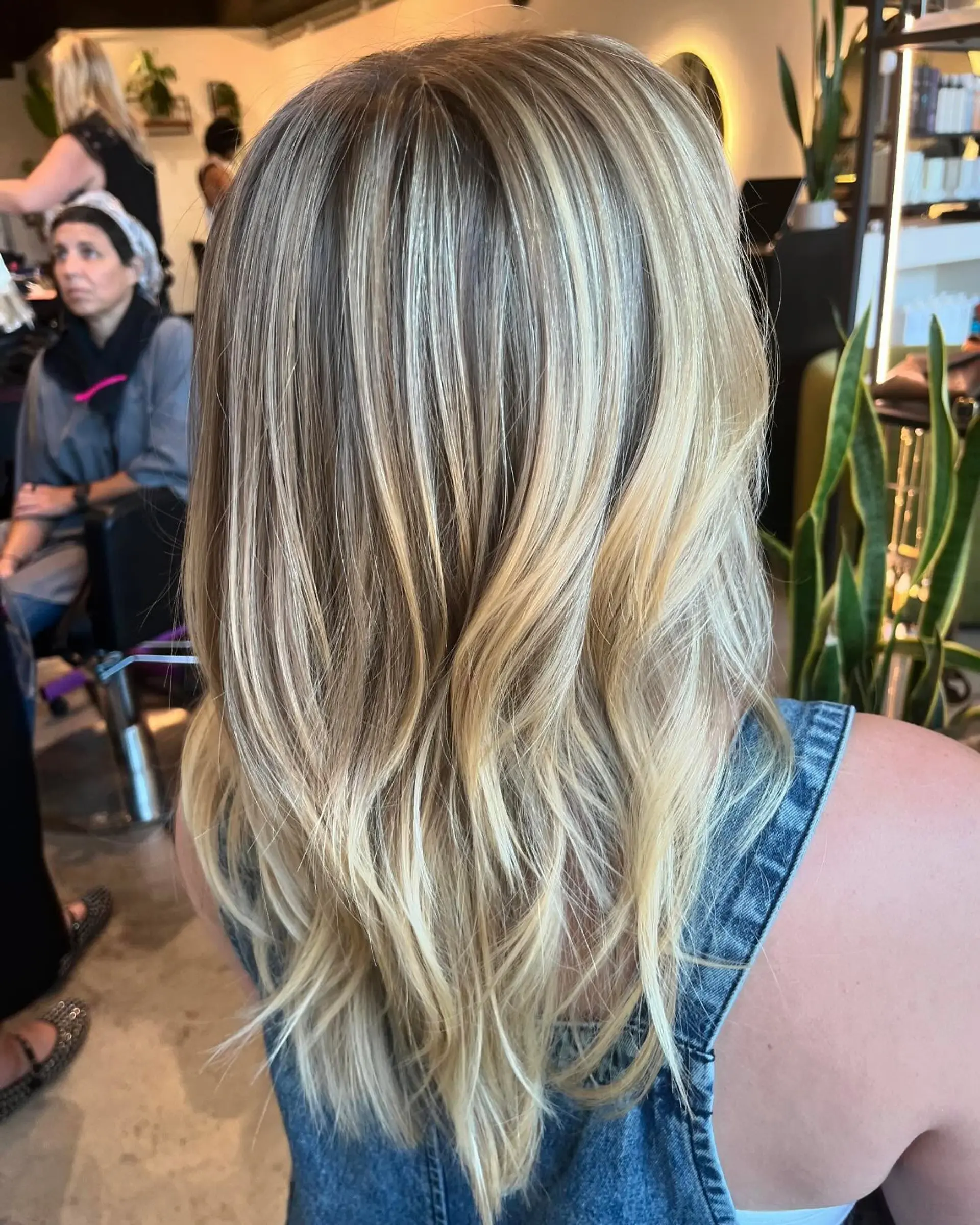 Seamlessly blended multi-tonal blonde highlights over a soft, natural base with subtle movement at the ends. 1