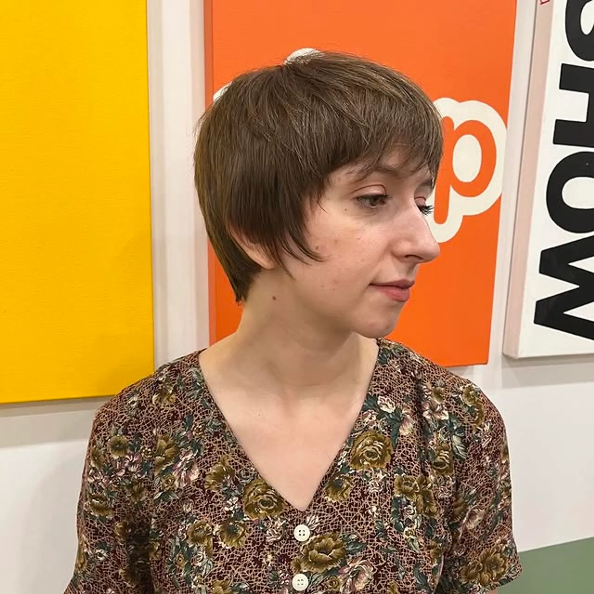 A chic pixie cut with textured bangs and a modern, layered finish. 1