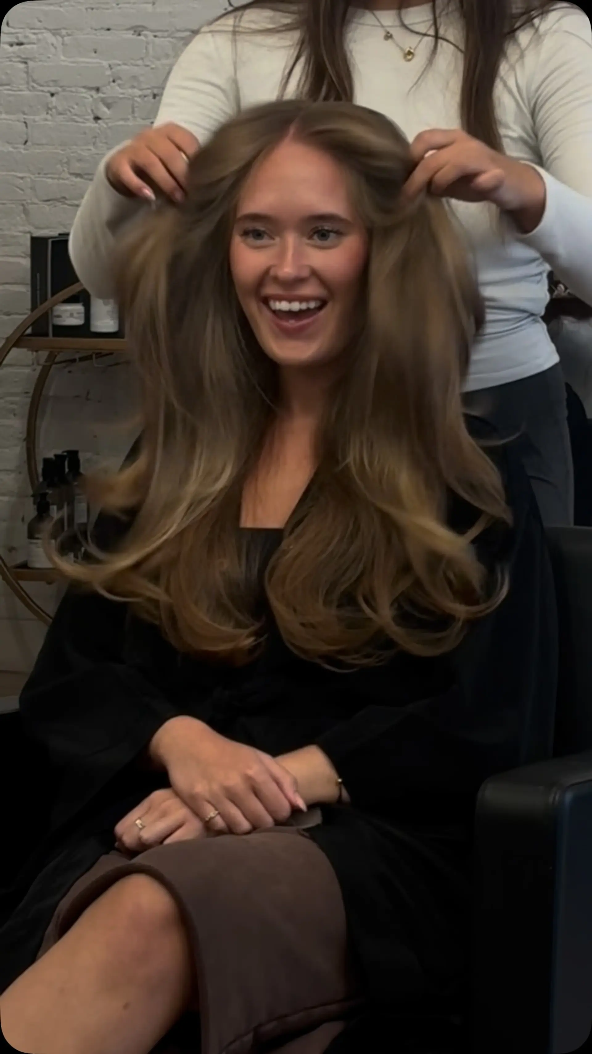 A big, voluminous blowout on long layers with soft face-framing sections and bouncy curved ends. 1