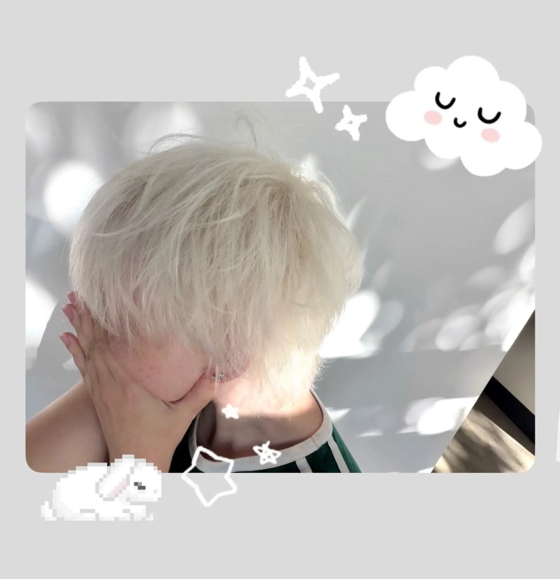 A textured short crop in an ultra-light platinum blonde shade with wispy, full fringe styling. 1